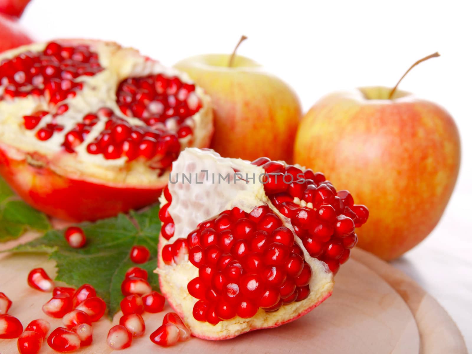 Pomegranate fruit, isolated on white background