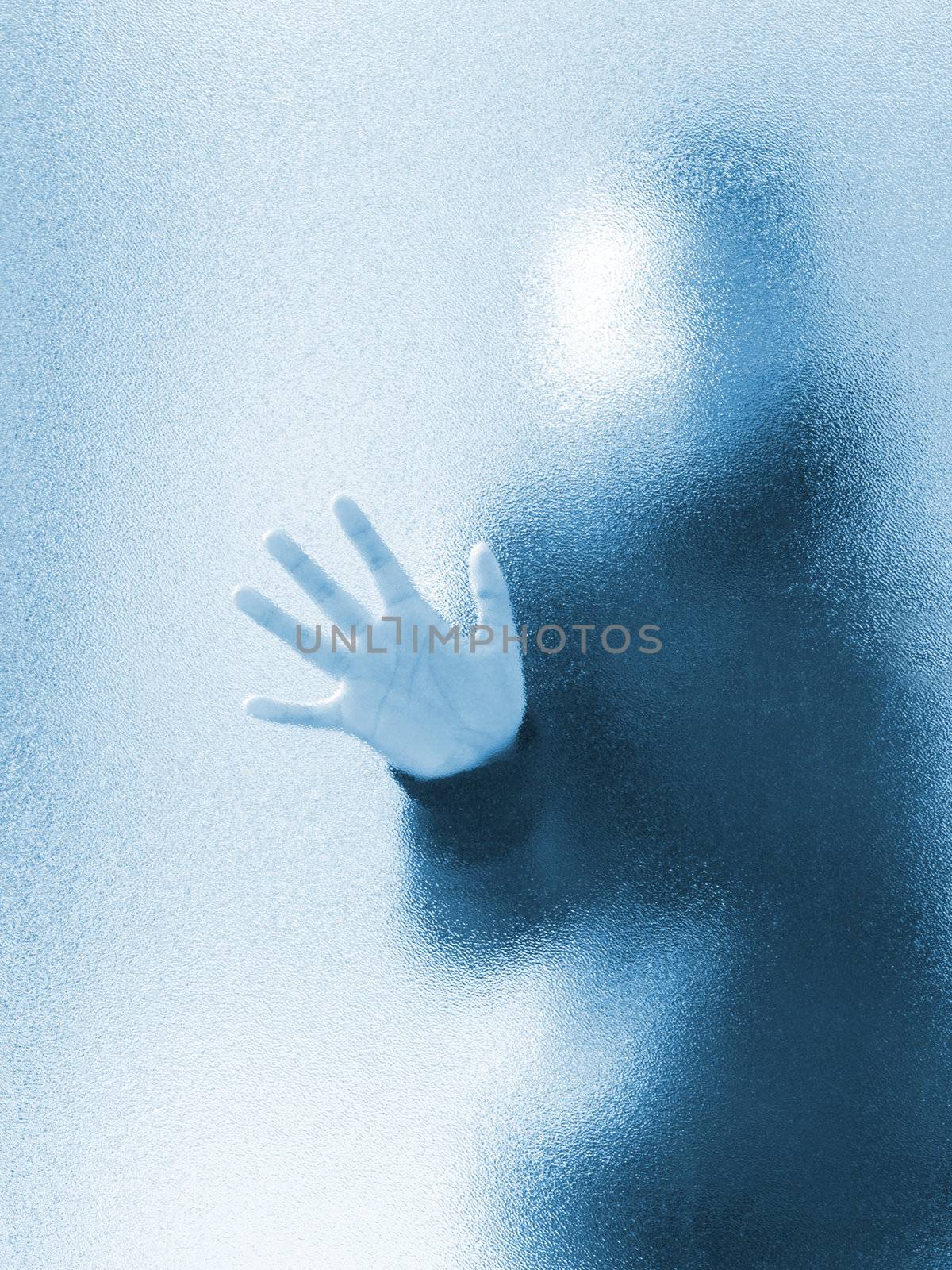 Silhouette of a girl through frosted glass 