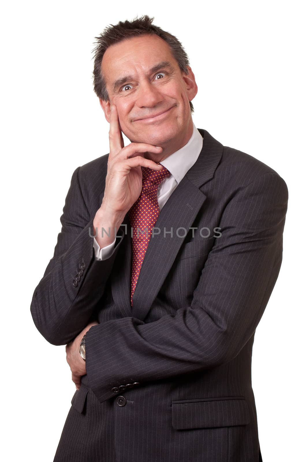 Business Man in Suit with Silly Grin and Hand to Face by scheriton