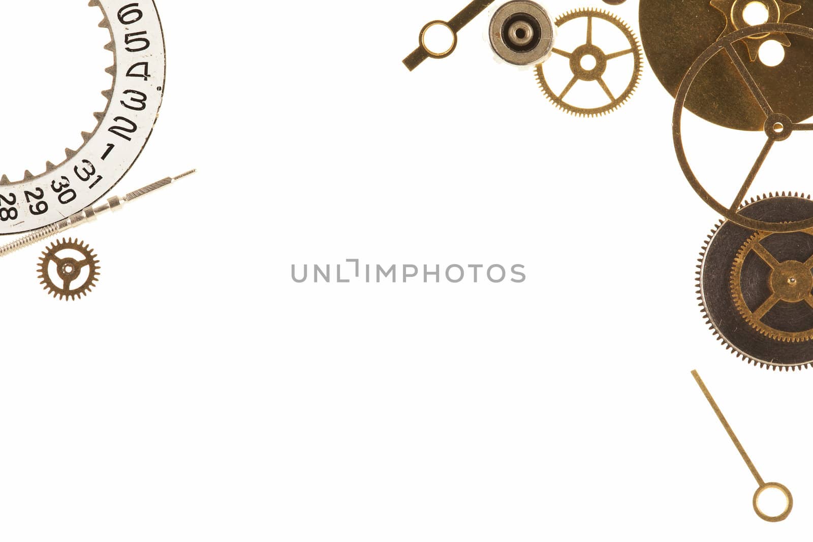 Cogs and other watch parts isolated on white background with copy space.