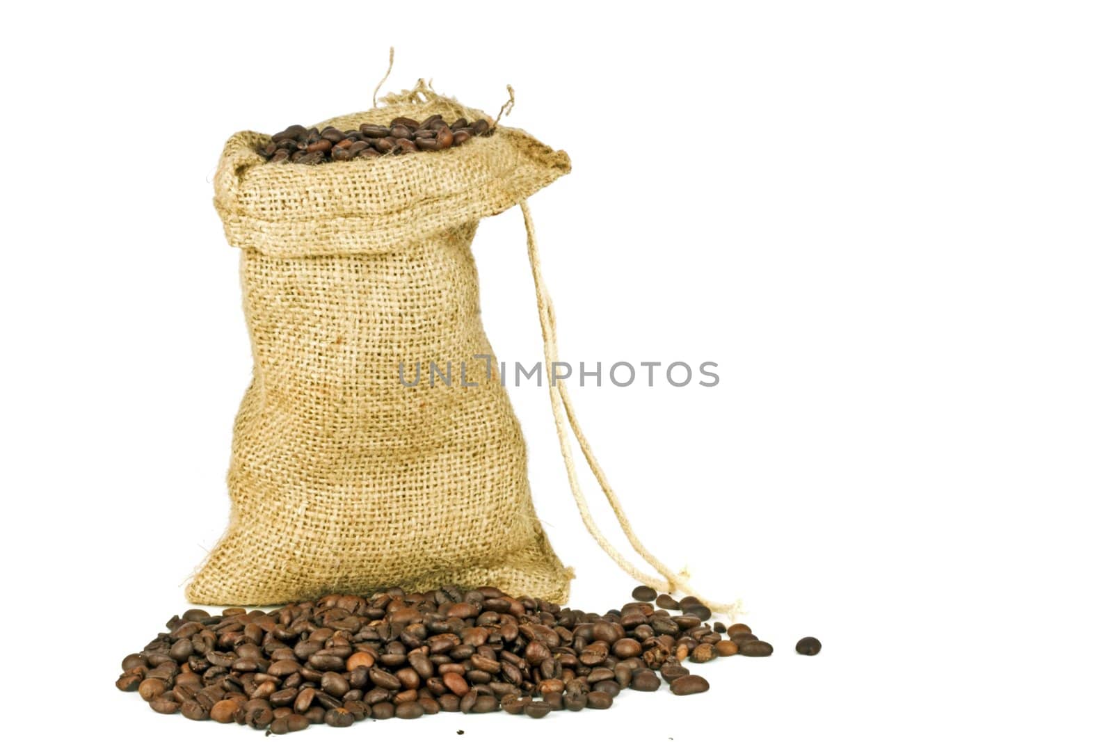 Coffee beans in a jute bag on a white background