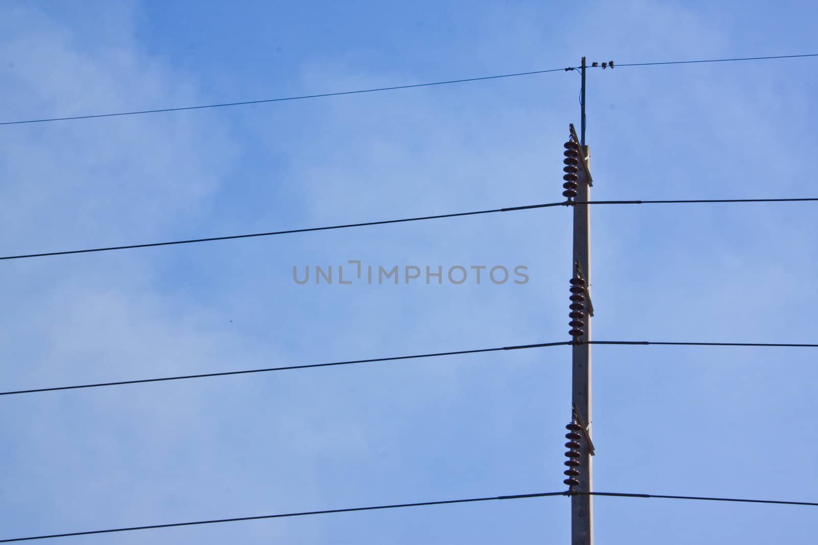 This is a Electricity post on blue sky background