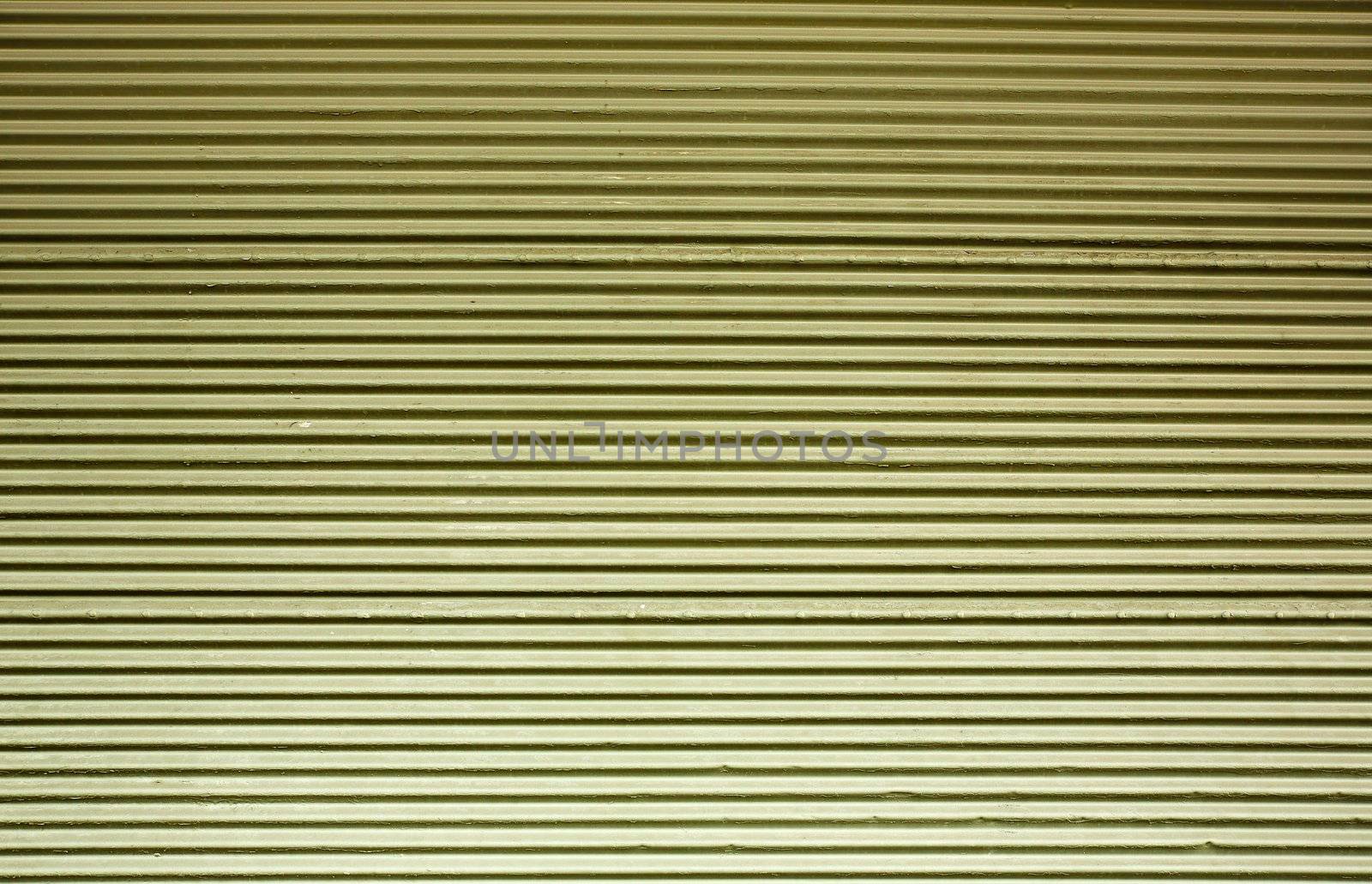 Horizontal corrugated steel wall with a green tint