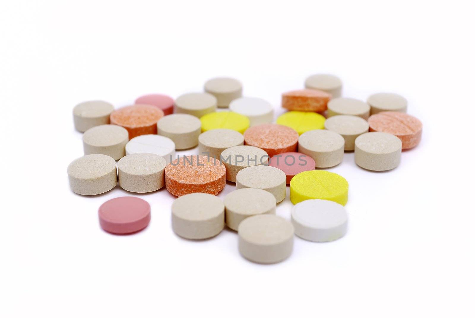 colored pills on a white background