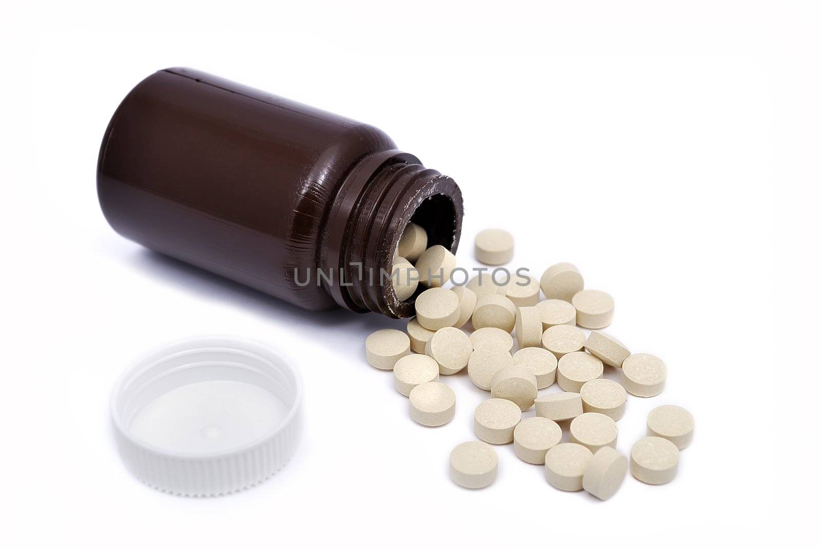 open a jar of pills on white background