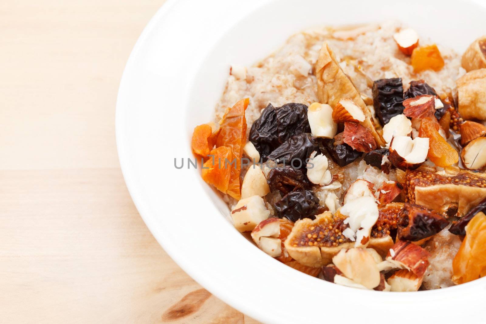 oatmeal with raisins, nuts and maple syrup