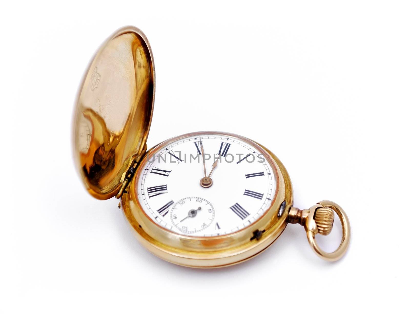 old gold pocket watch on a white background