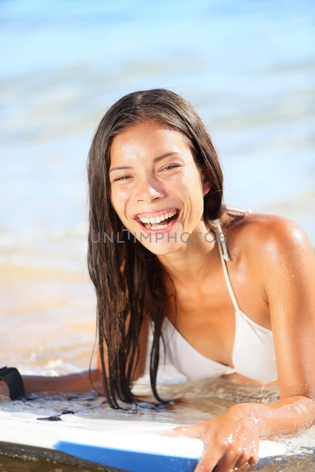 Water sport fun - beach woman bodyboarding surfing by Maridav