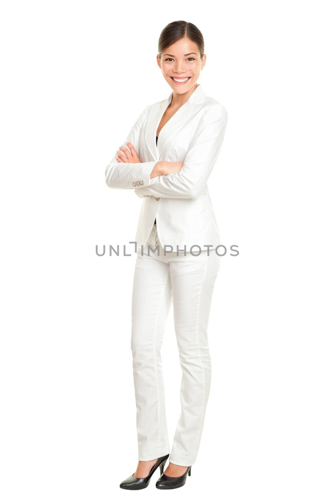 Asian business woman standing proud and confident in white suit isolated on white background in full body. Beautiful young mixed race Chinese Asian / Caucasian female businesswoman smiling happy.