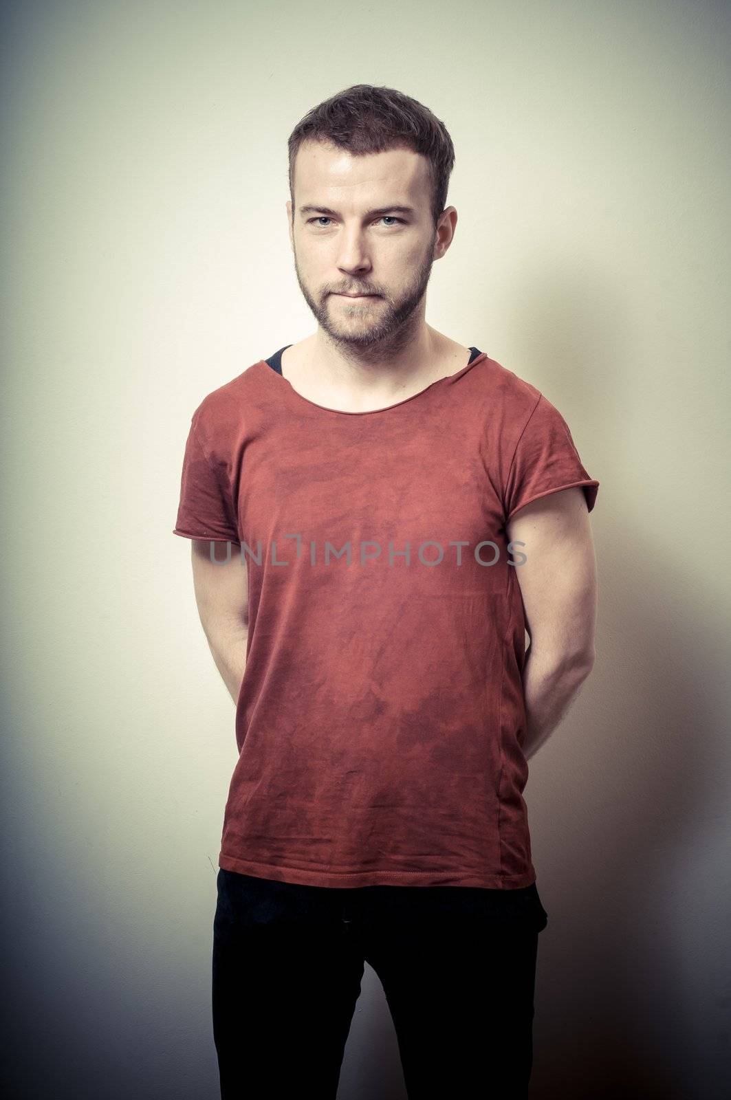 vintage portrait of fashion guy on gray background
