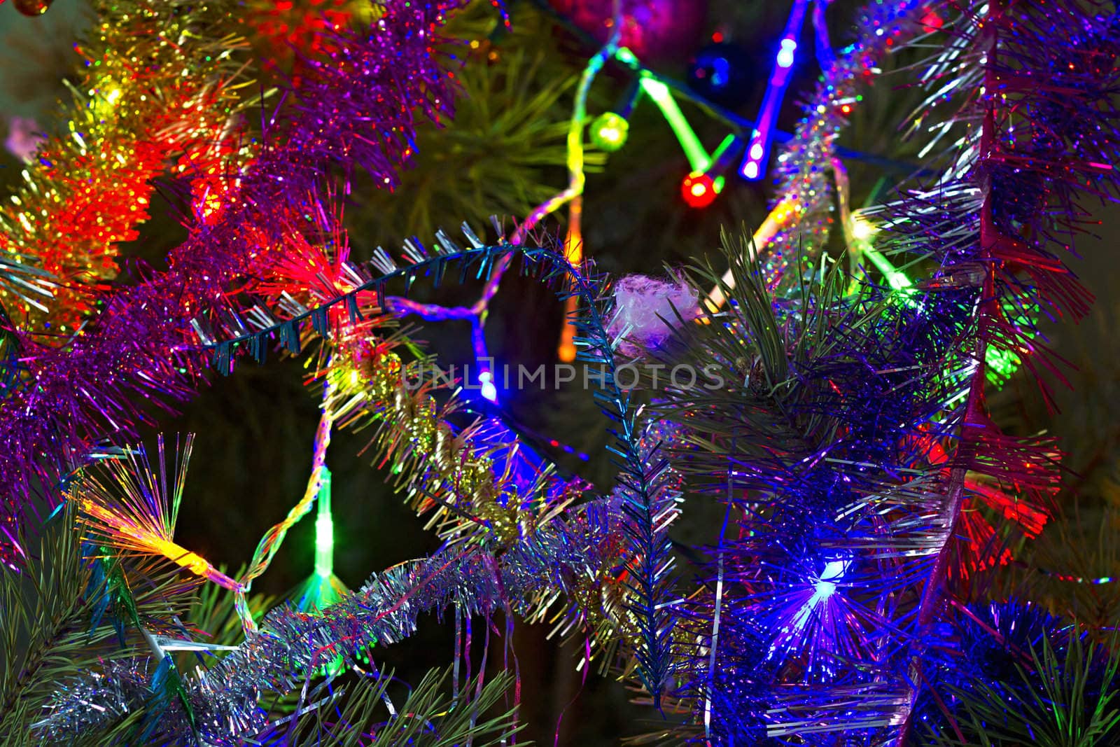 Christmas background of tinsel and garlands on the tree