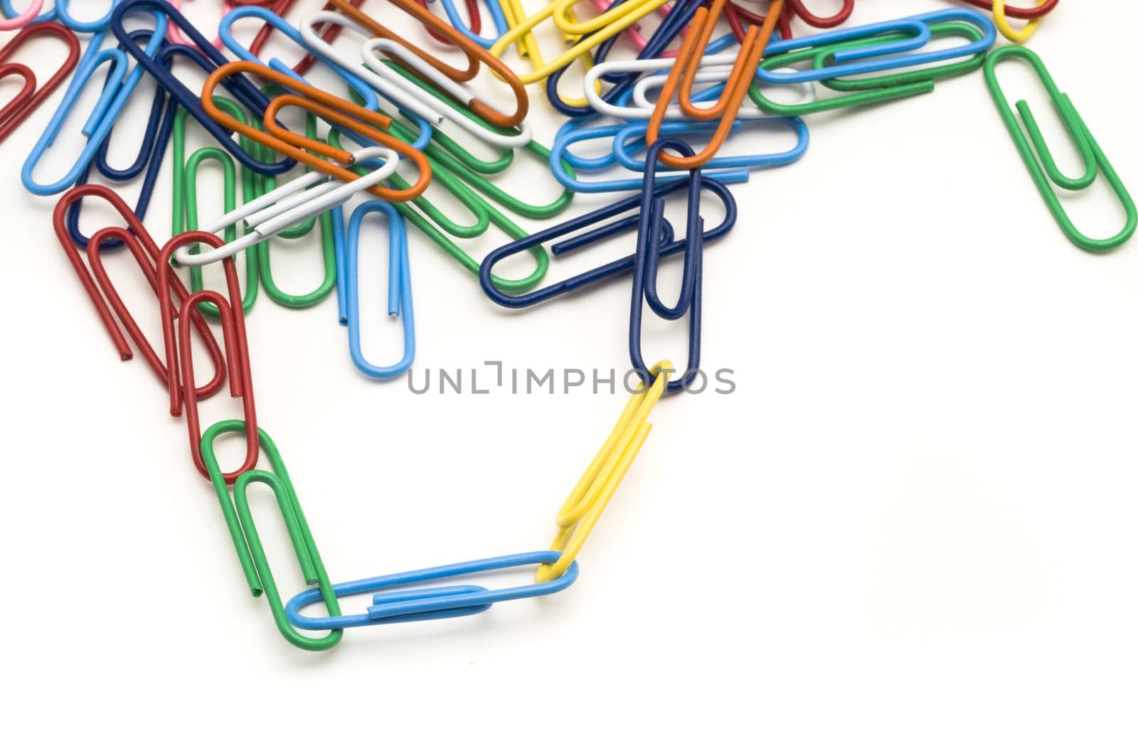 Connected colourful paper clips on white background