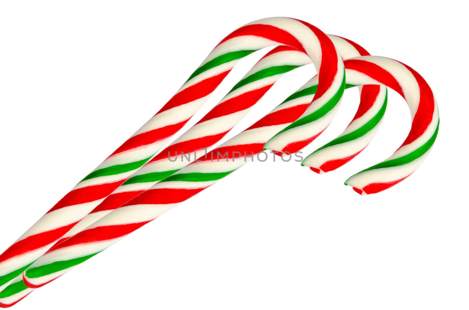 Three sugar sticks in white green and red isolated on white background