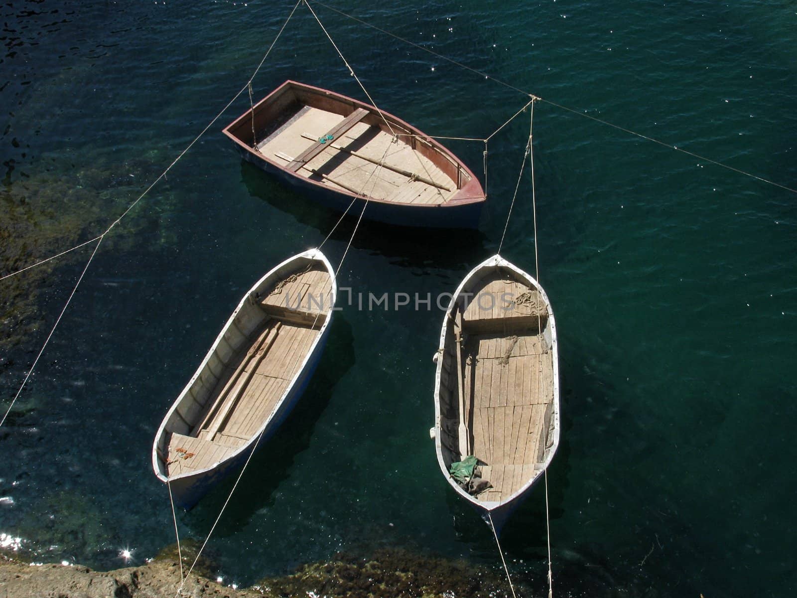 three fishing boats at coast