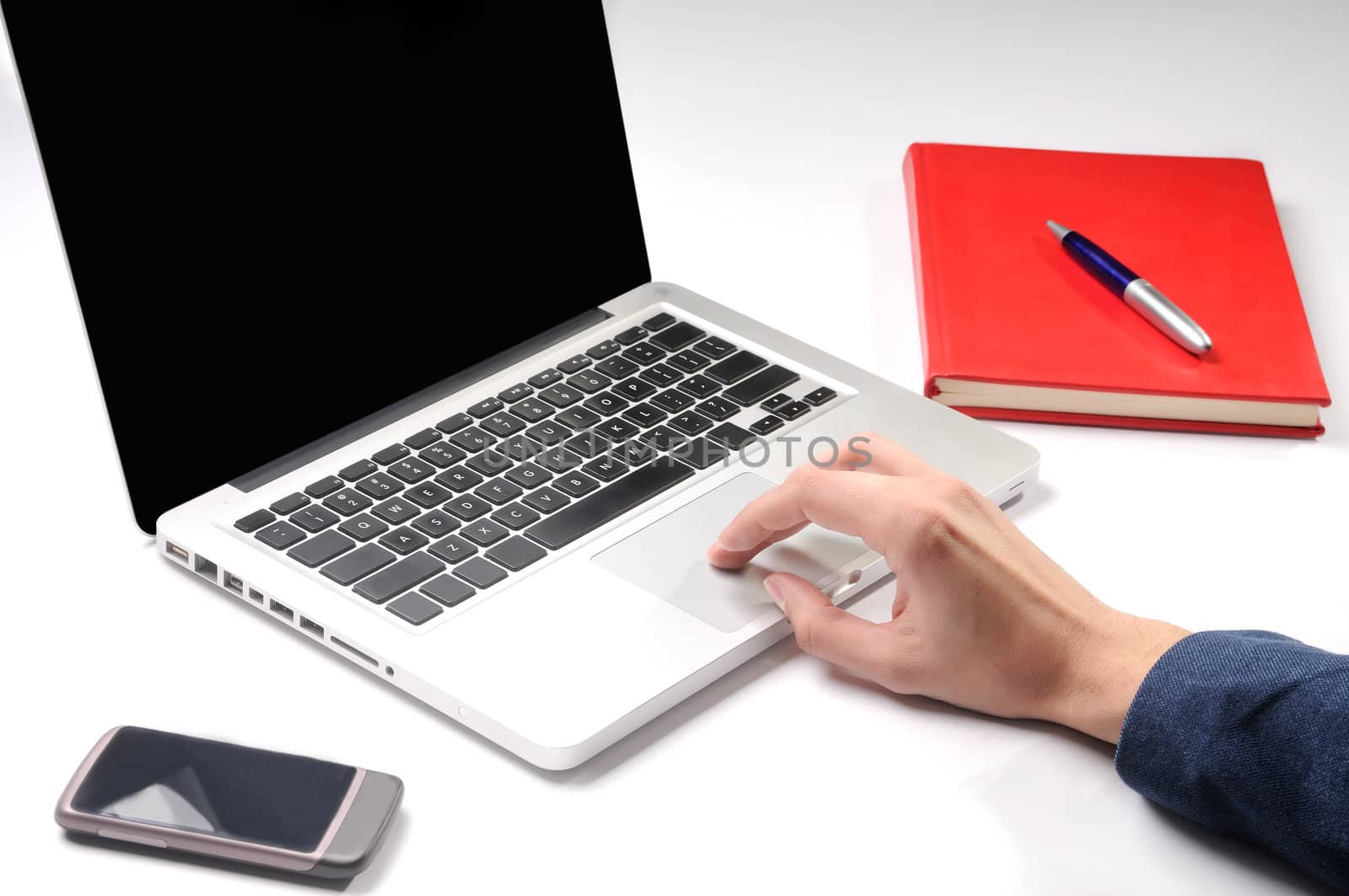 Closeup on hand, businessman working on laptop