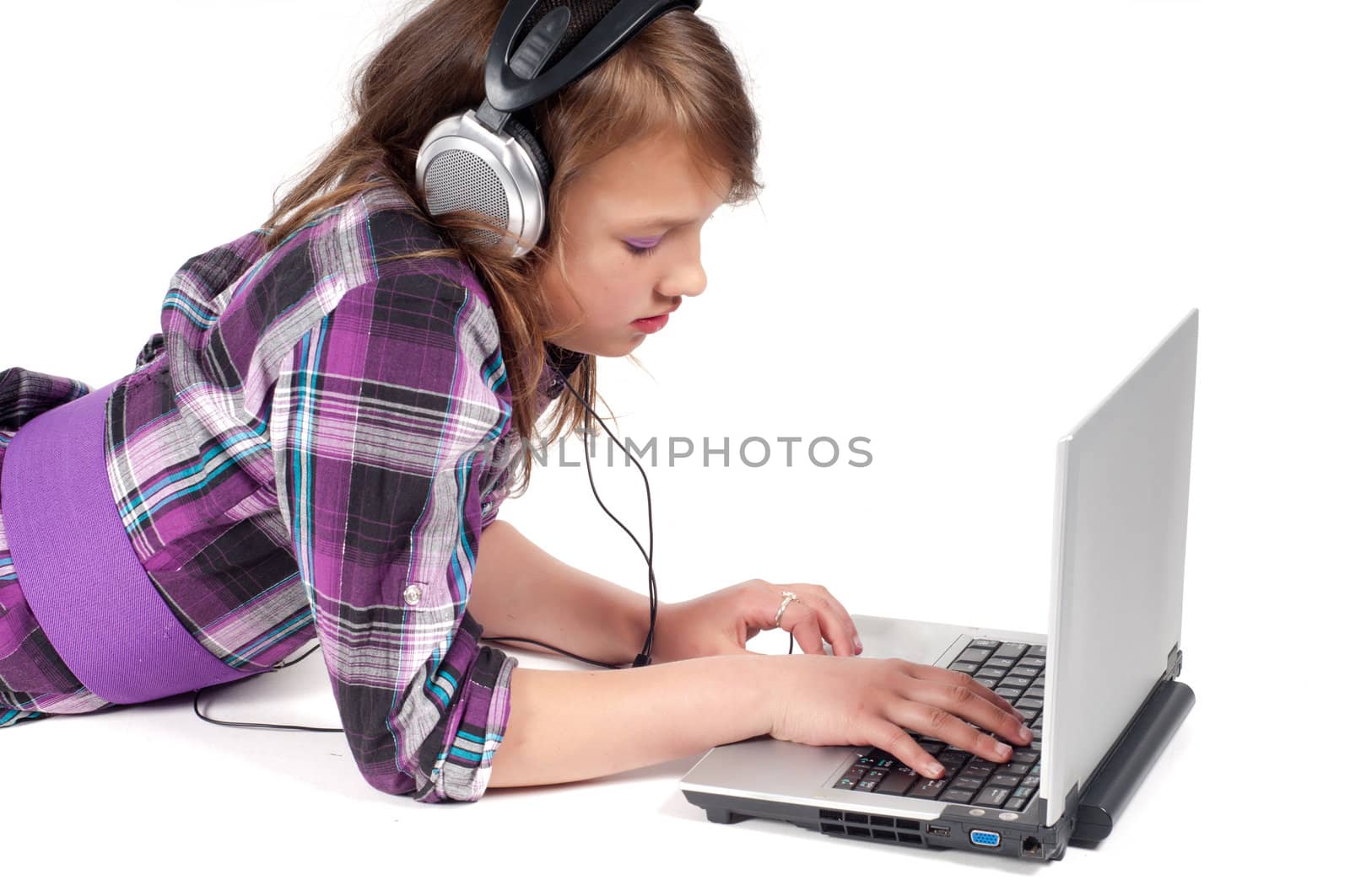 Teenager girl with notebook in studio isolated on white