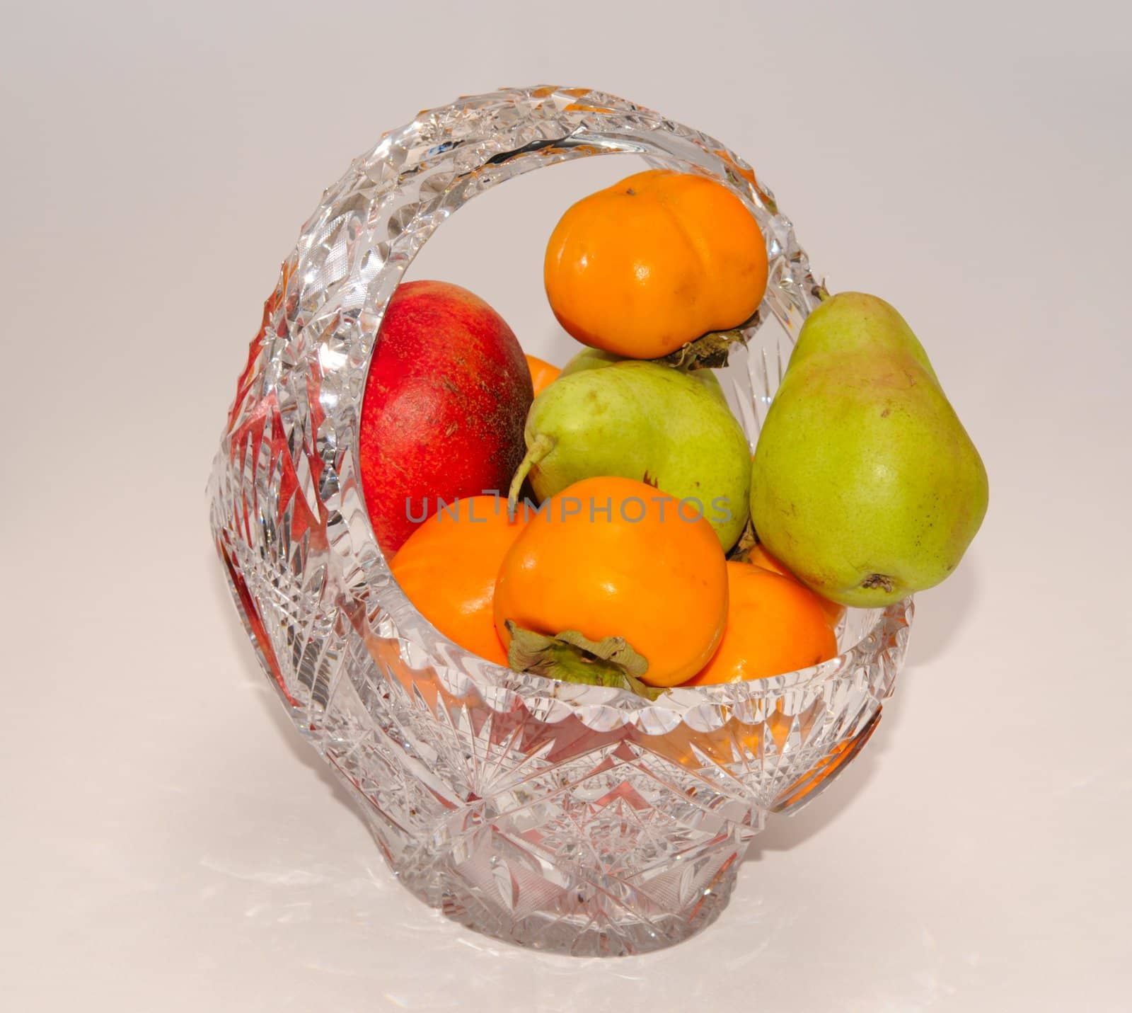 Pears, Persimmons And Pomegranate In Transparent Crystal Bowl.
