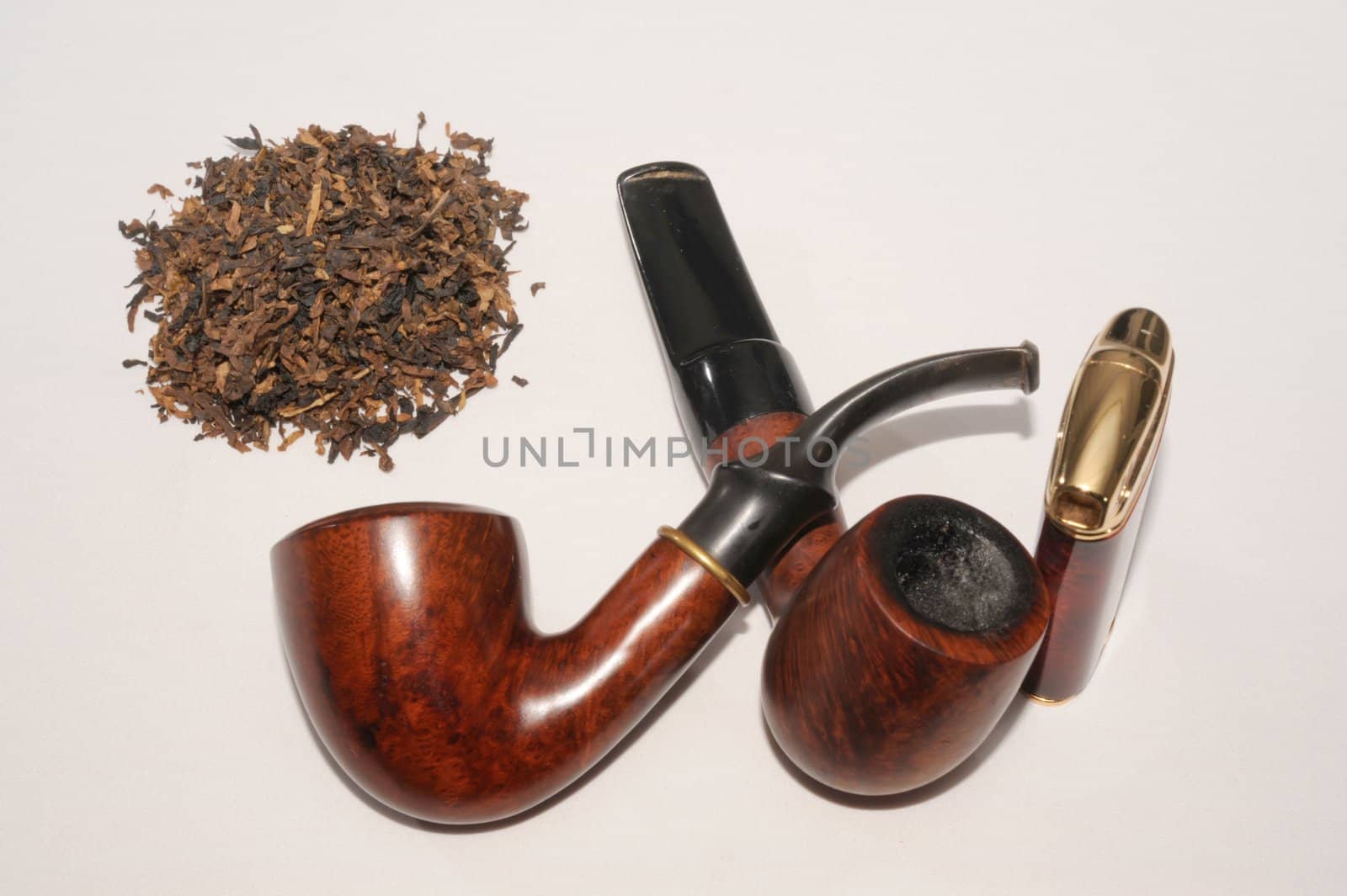 Tobacco,  Lighter And Two Smoking Pipes On White Background. 