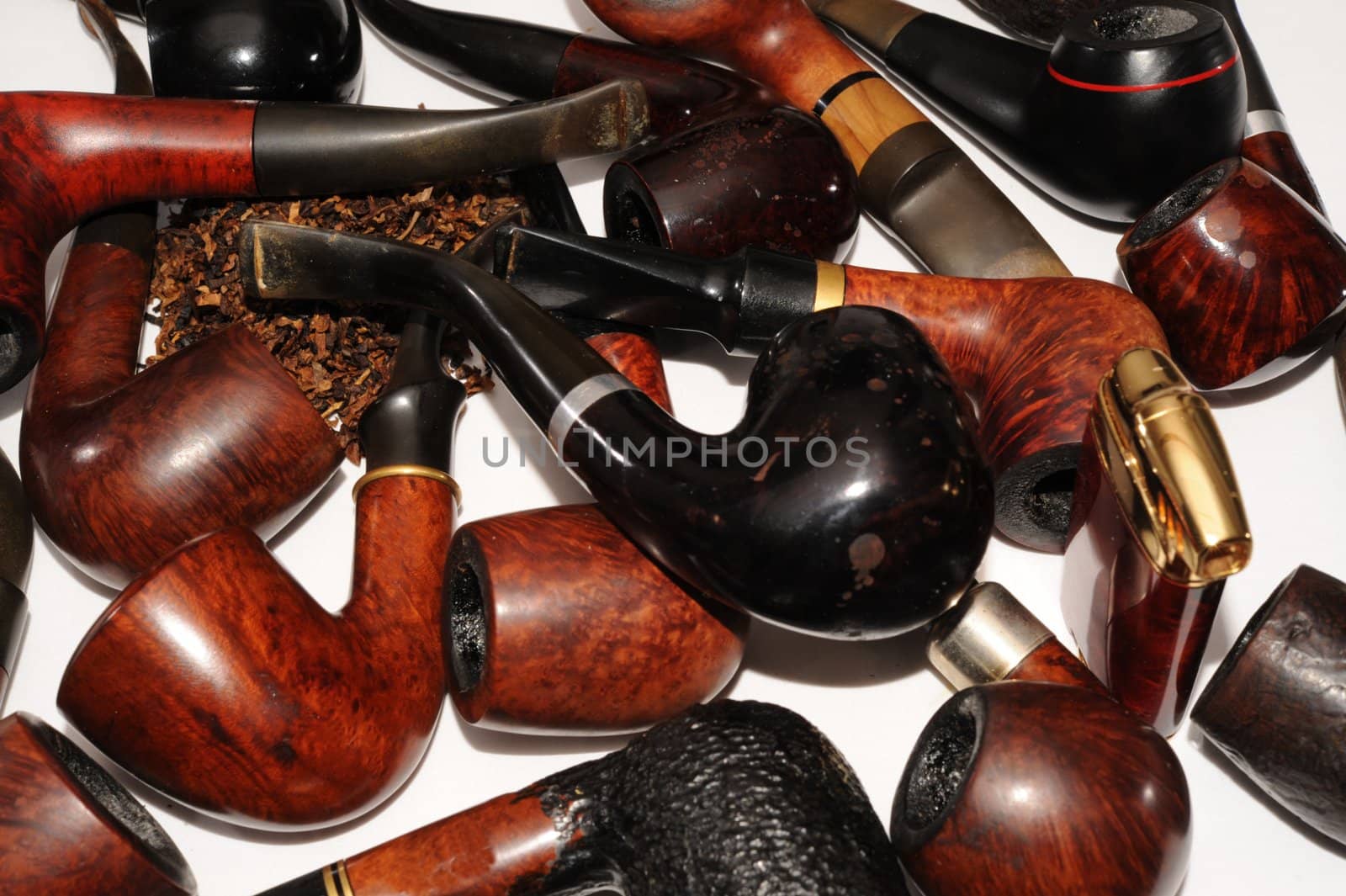  Lighter And Many Smoking Pipes On White Background. 
