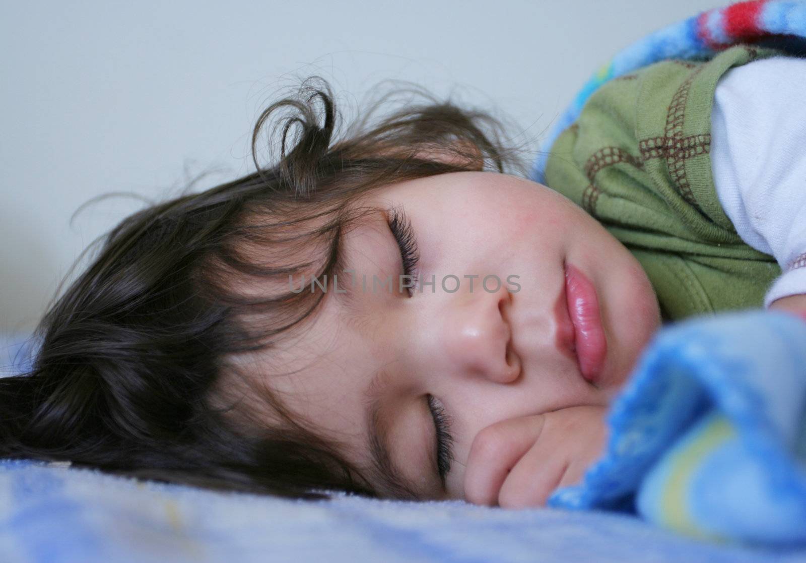 Beautiful sleeping boy  toddler. Part Scandinavian, thai background