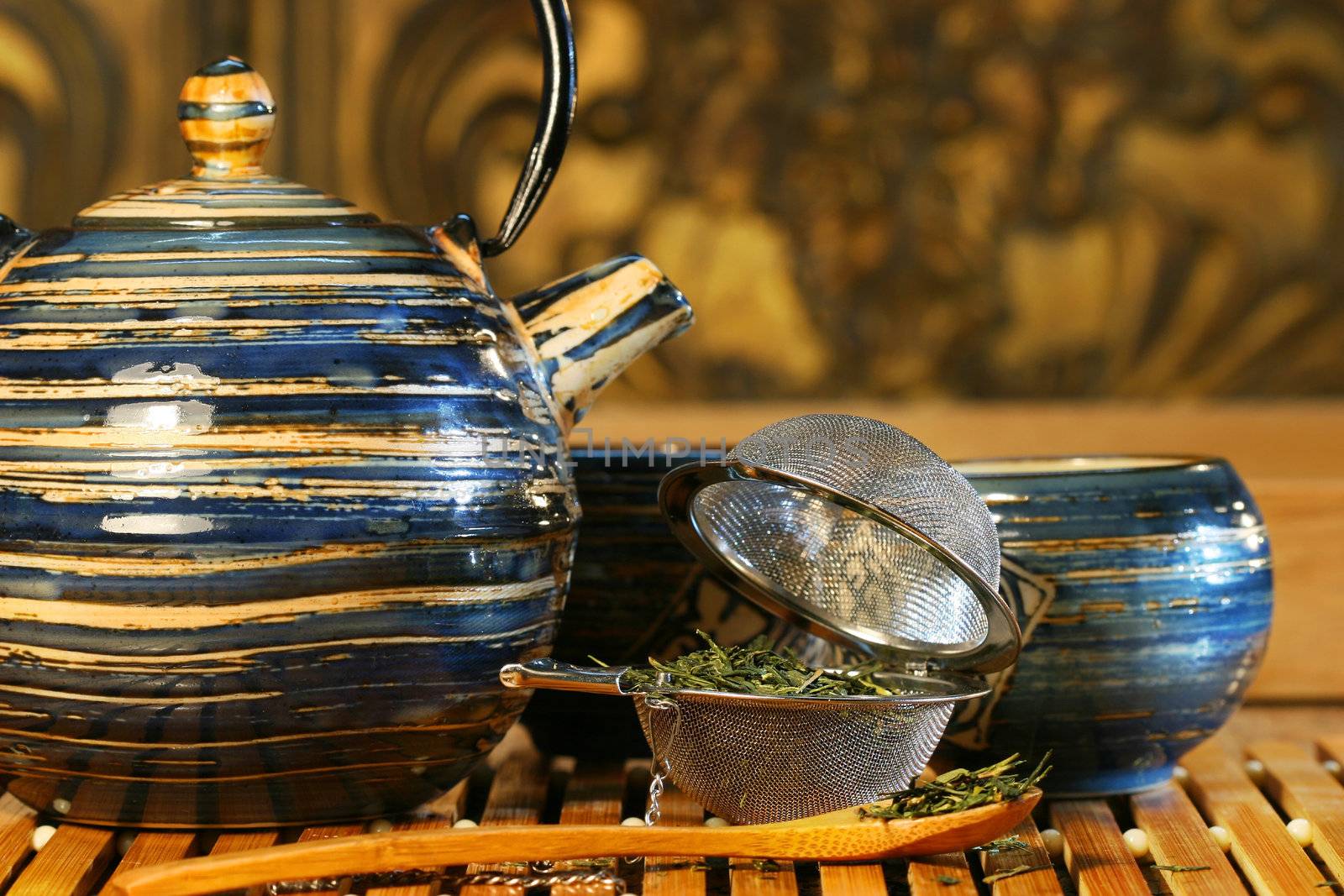 Blue Japanese teapot with strainer and green tea