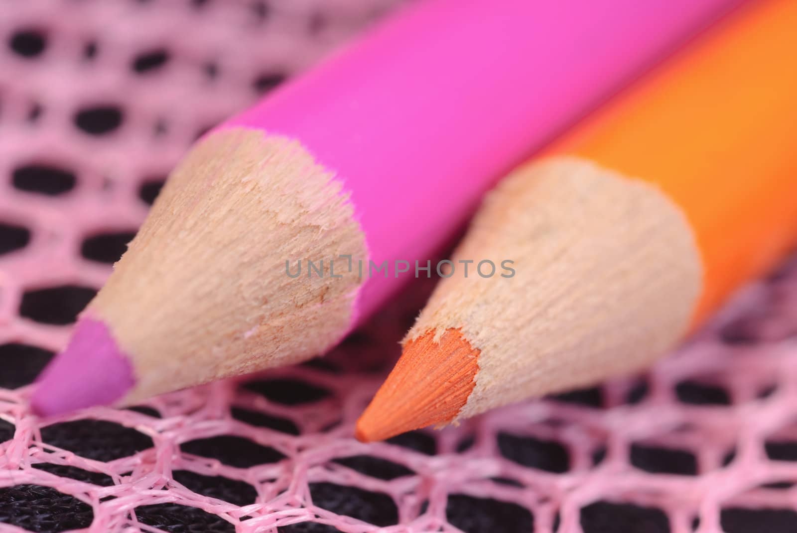 Graphite pencils. colored pencils close-up on a dark background