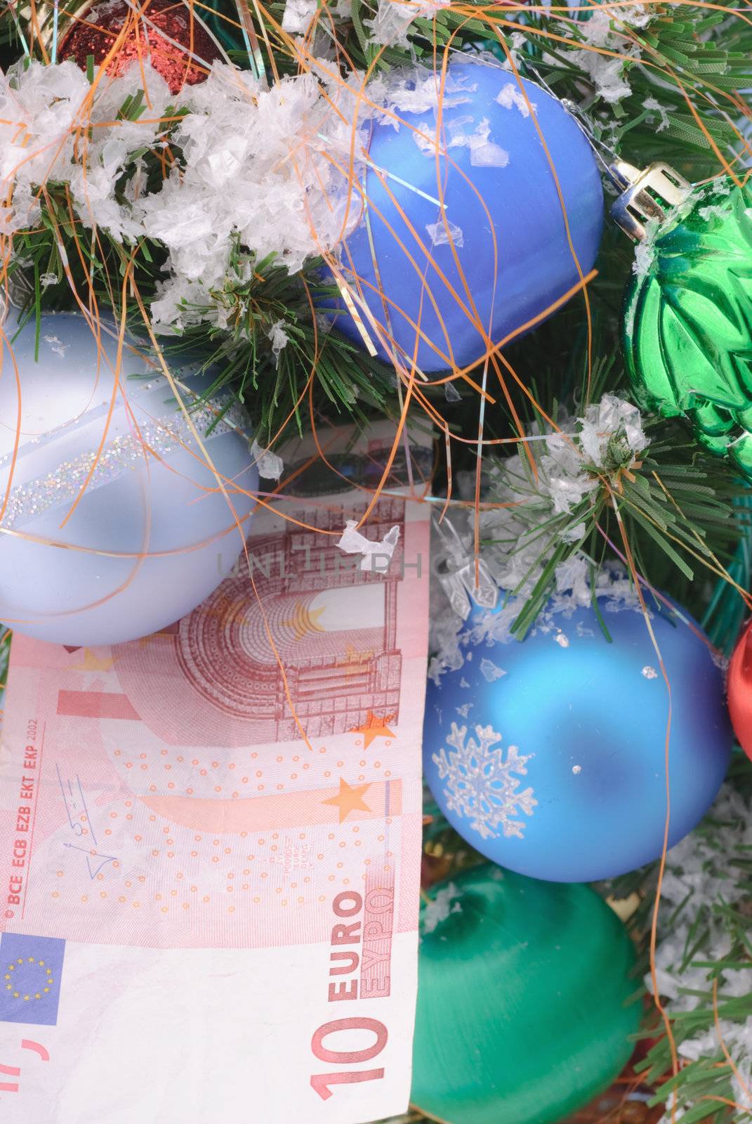 Banknotes euro are under the Christmas tree