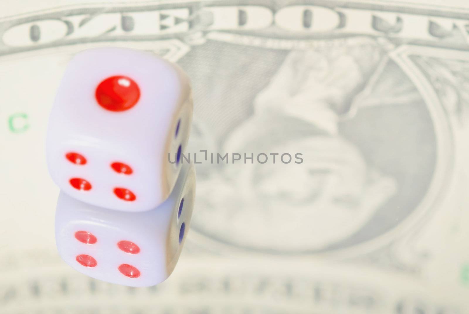 Financial Concepts. Reflecting the dollar and dice in the mirror