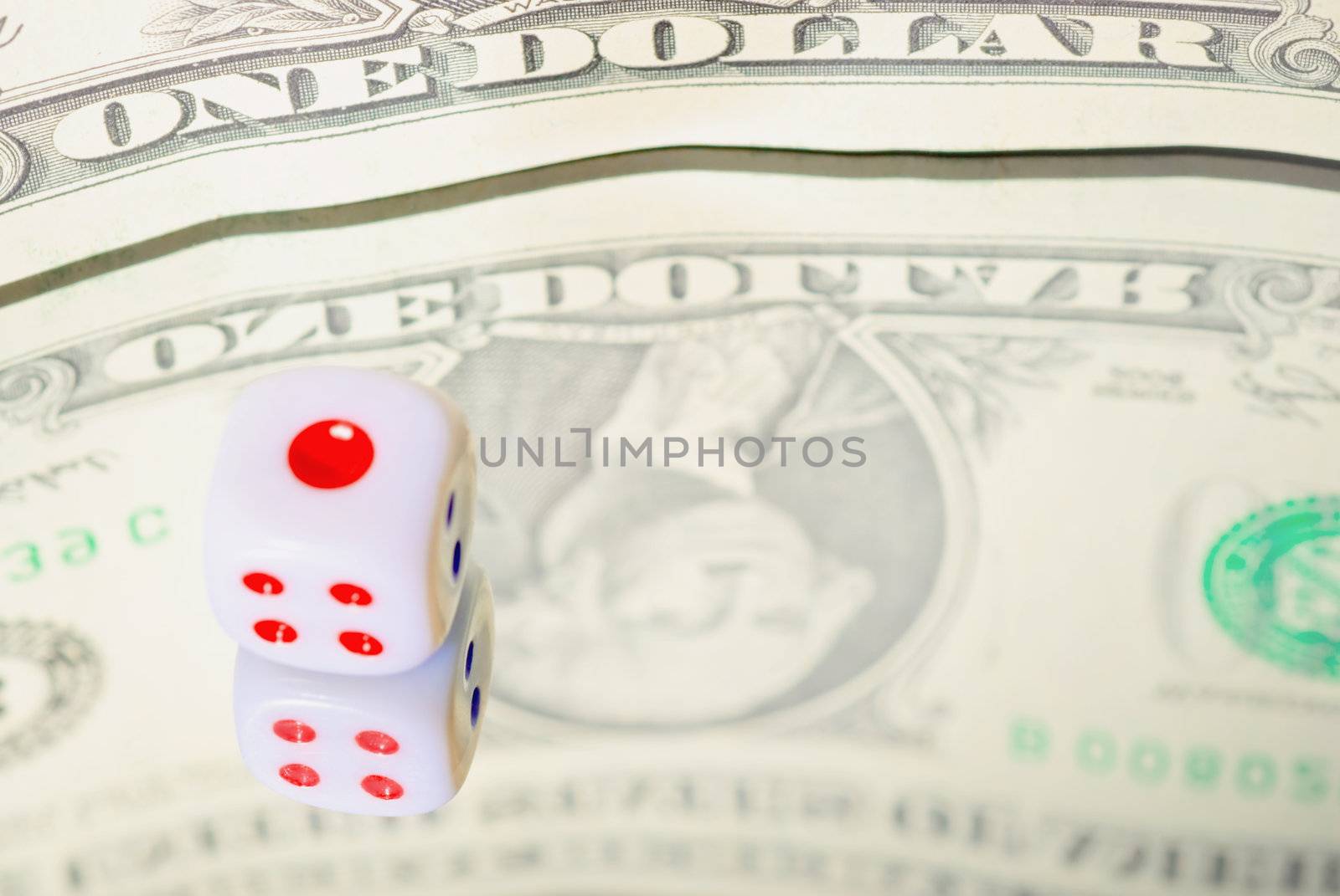 Financial Concepts. Reflecting the dollar and dice in the mirror