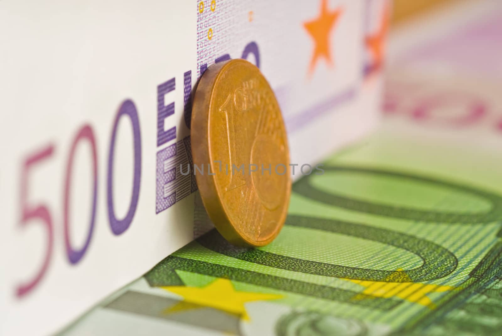 Two euro banknotes and coins