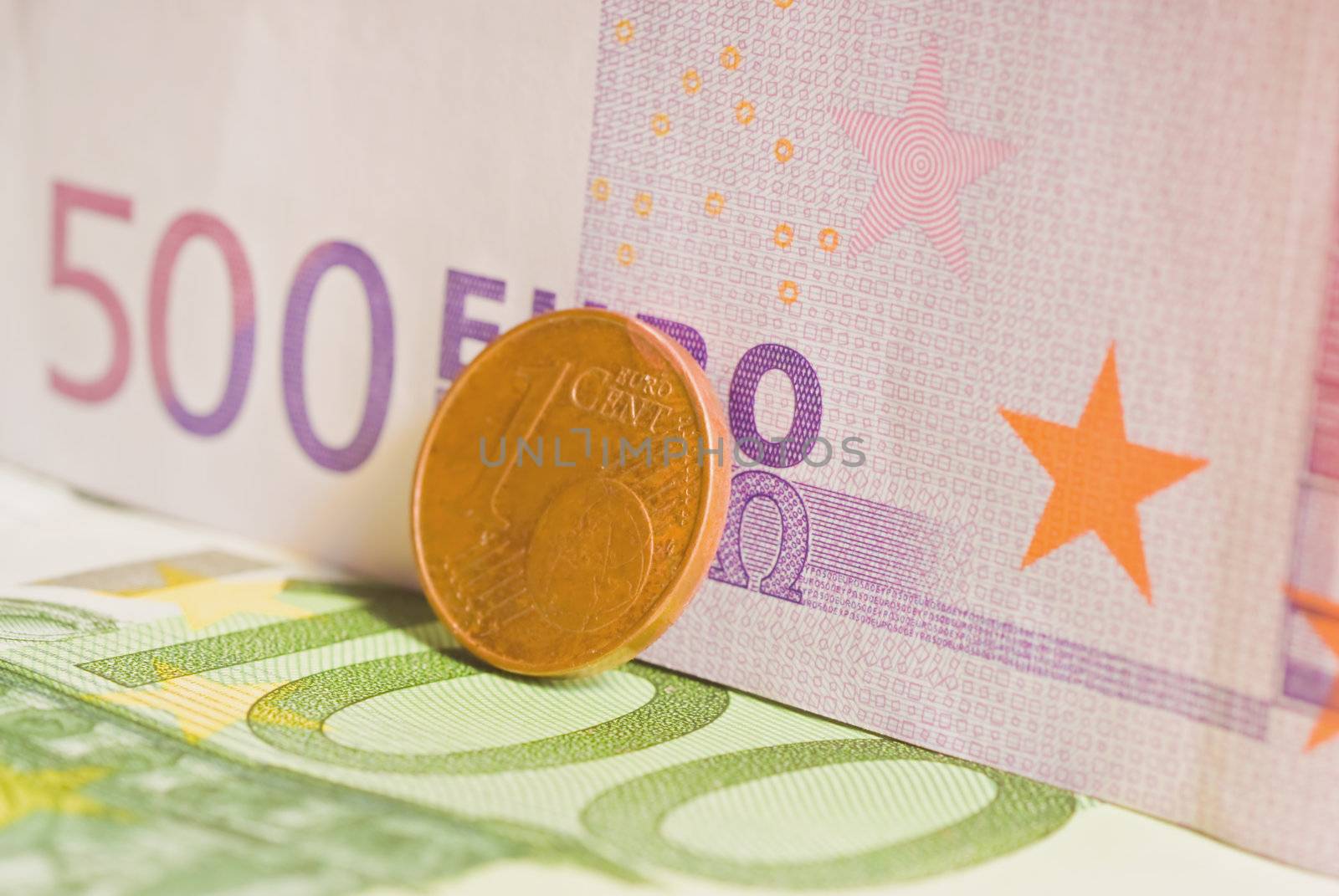 Coin and euro banknotes