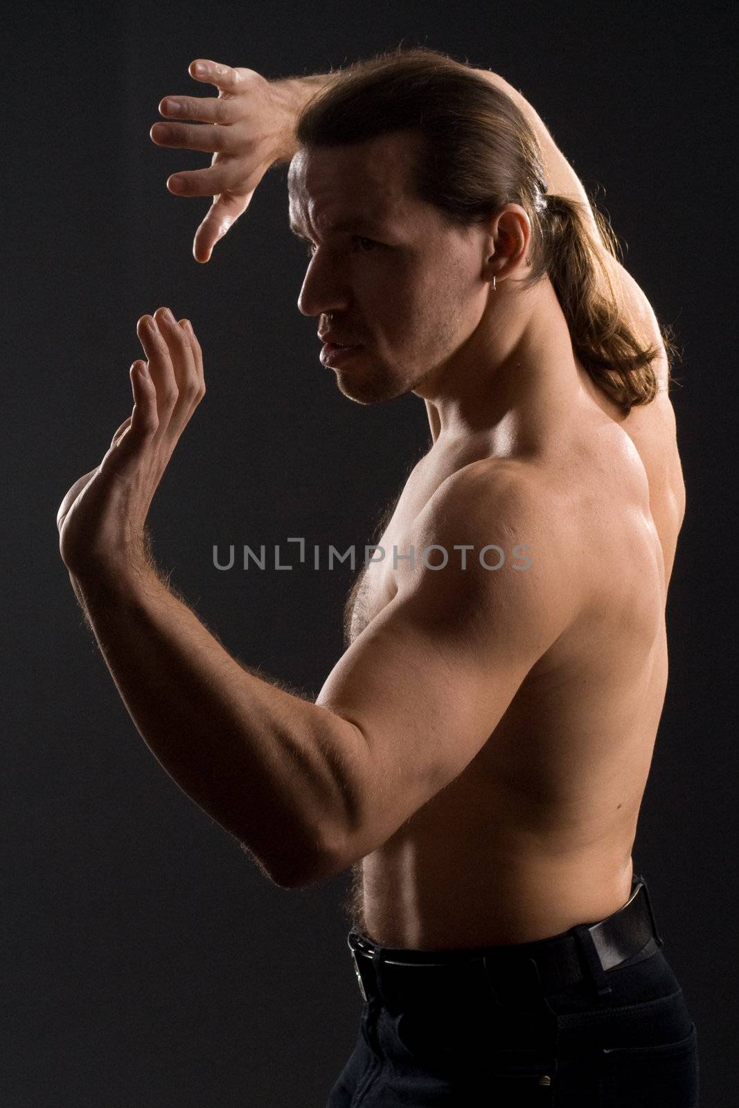 fighting man on black background 
