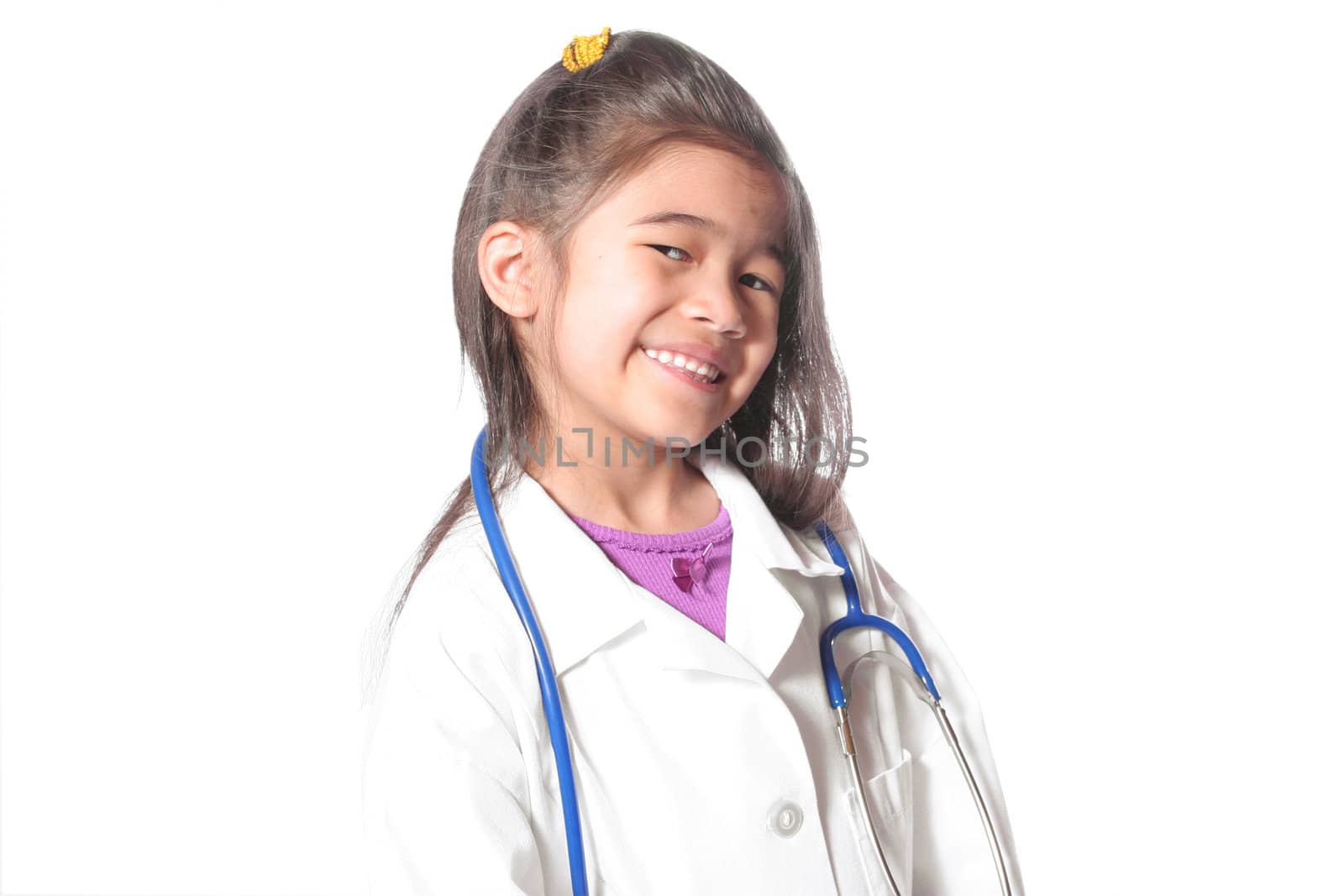 Adorable six year old in doctor's lab coat and stethoscope. part Asian, part Scandinavian descent.