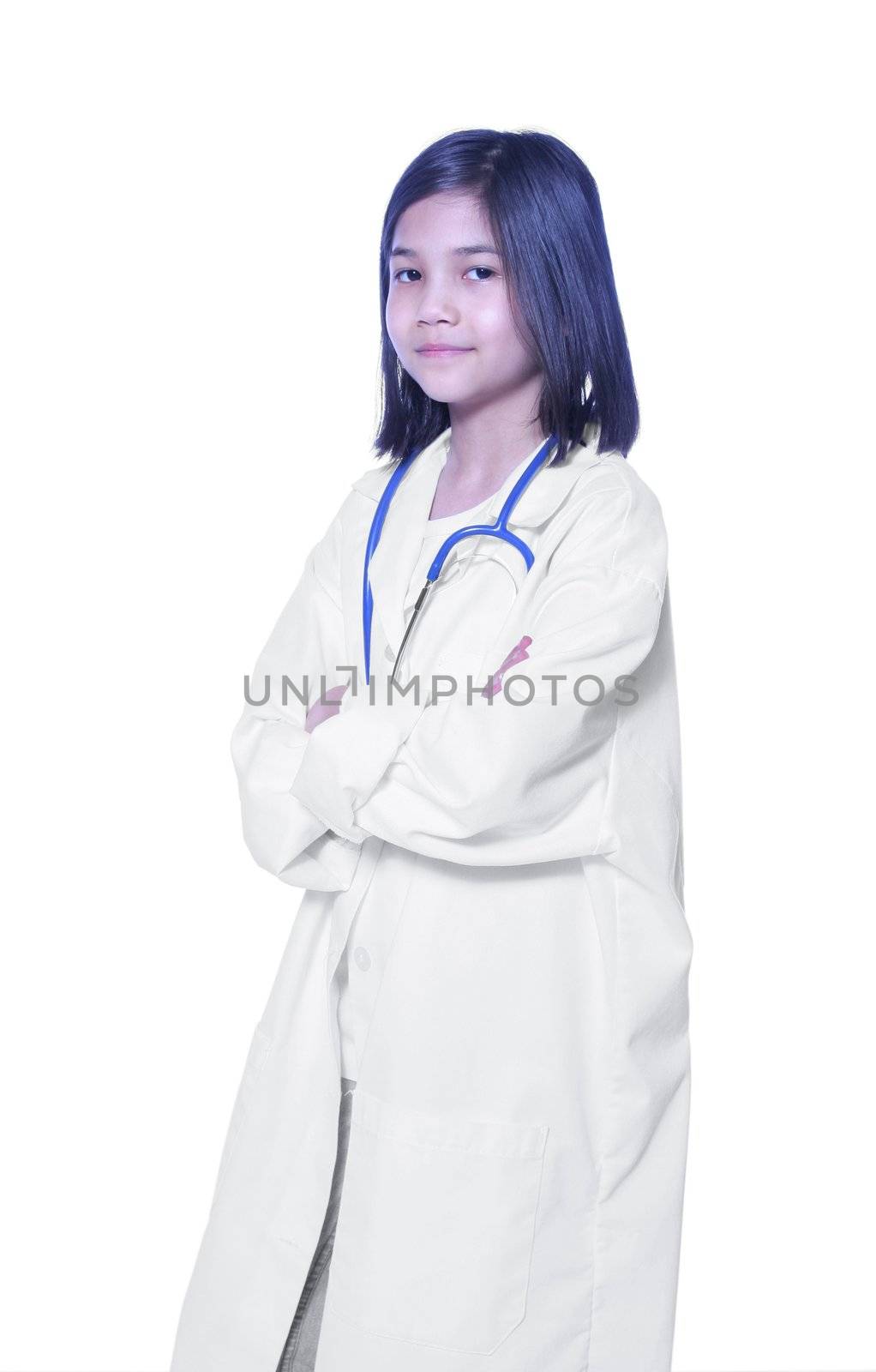 Nine year old girl playing doctor with white lab coat and stethoscope