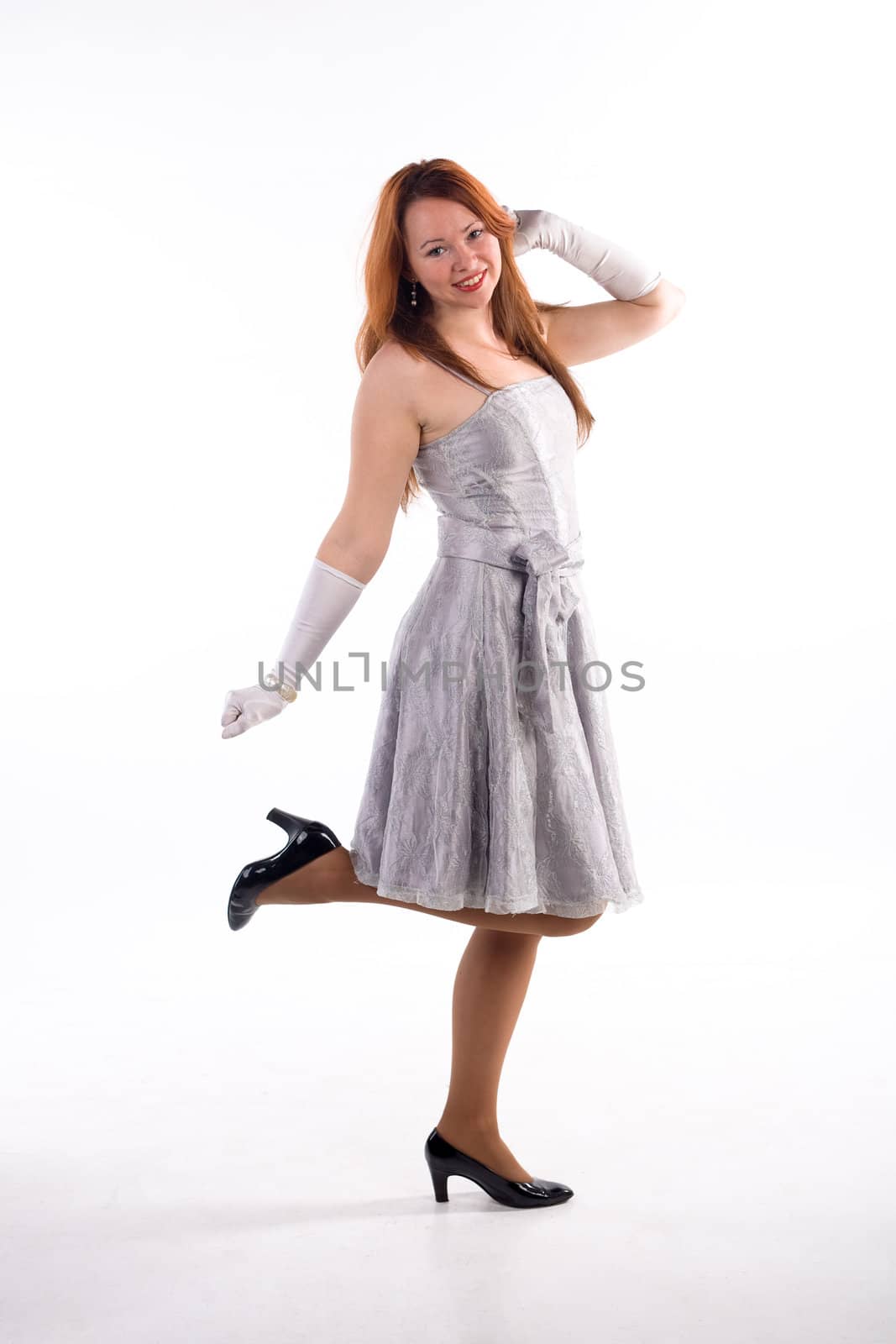 Young girl with white gloves standing on white background
