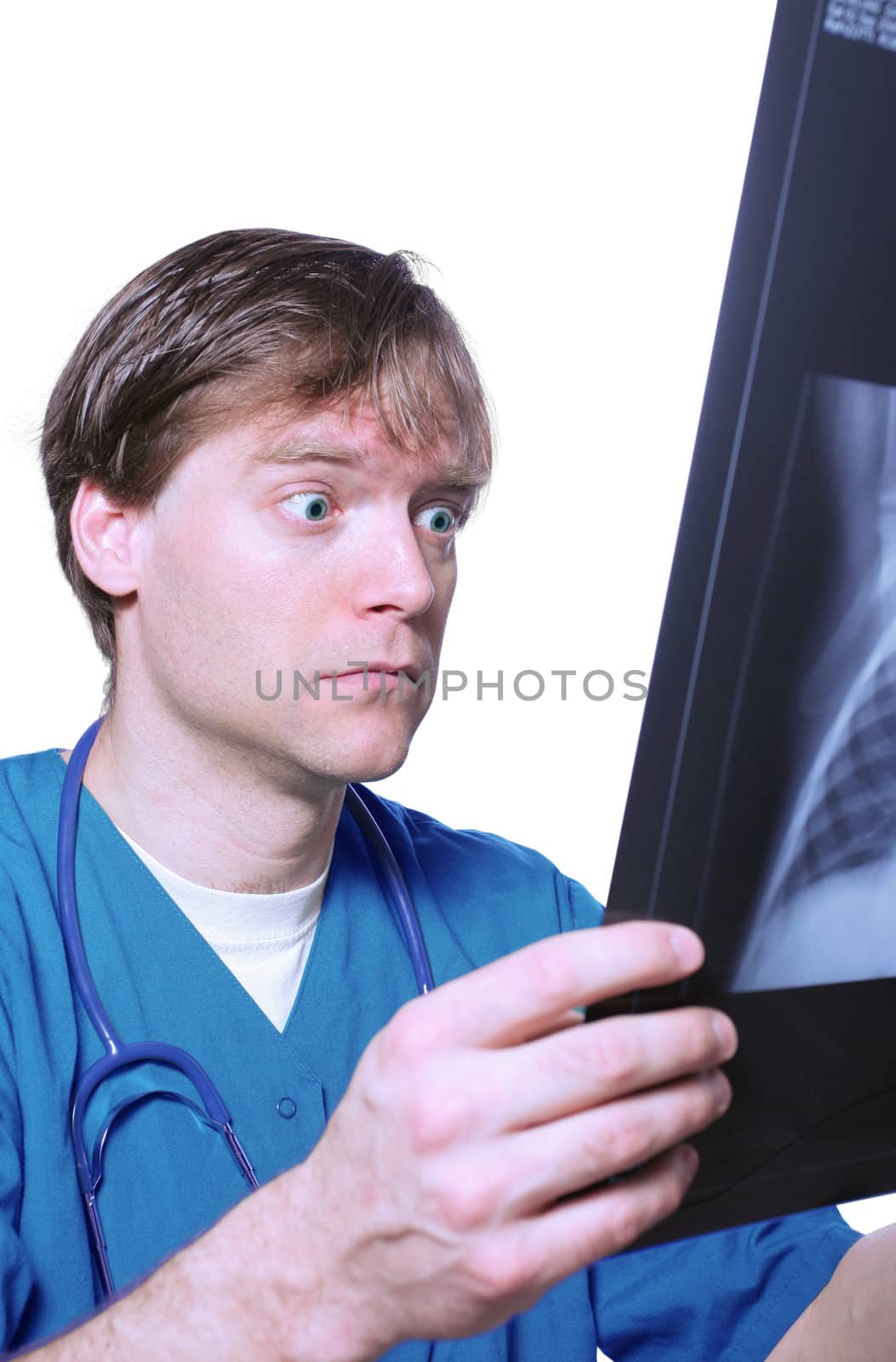 Male doctor looking with humorous shock at x ray