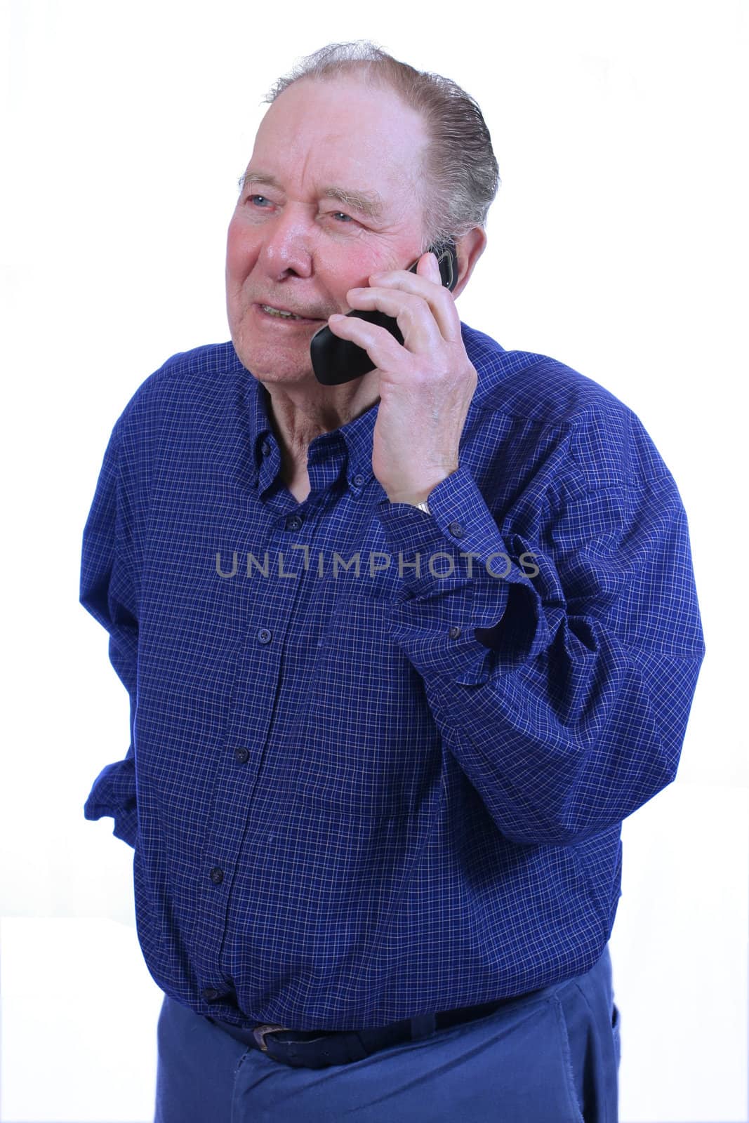 Elderly man using cell phone,talking on cell phne
