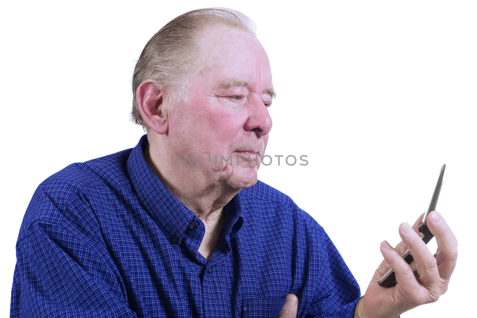 Elderly man figuring out how to use cell phone