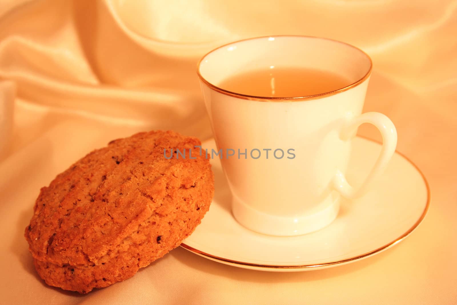 Cup of tea with biscuit  by oxanatravel