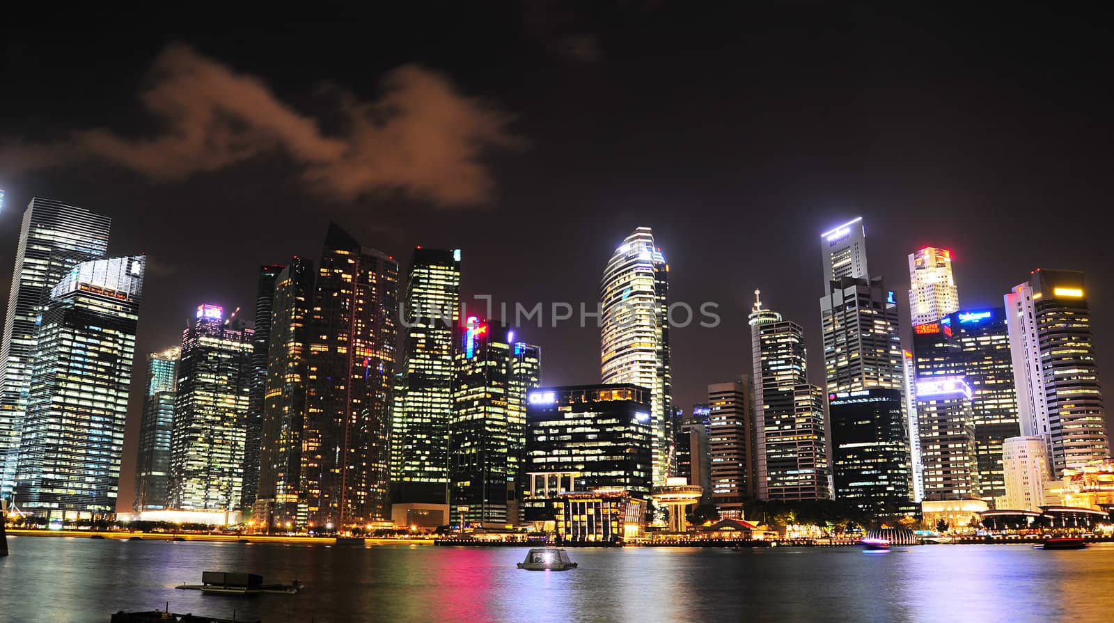  Singapore - March 05, 2013:  Night panorama of Singapore downtown. There are more than 7,000 multinational corporations from United States, Japan and Europe in Singapore. 