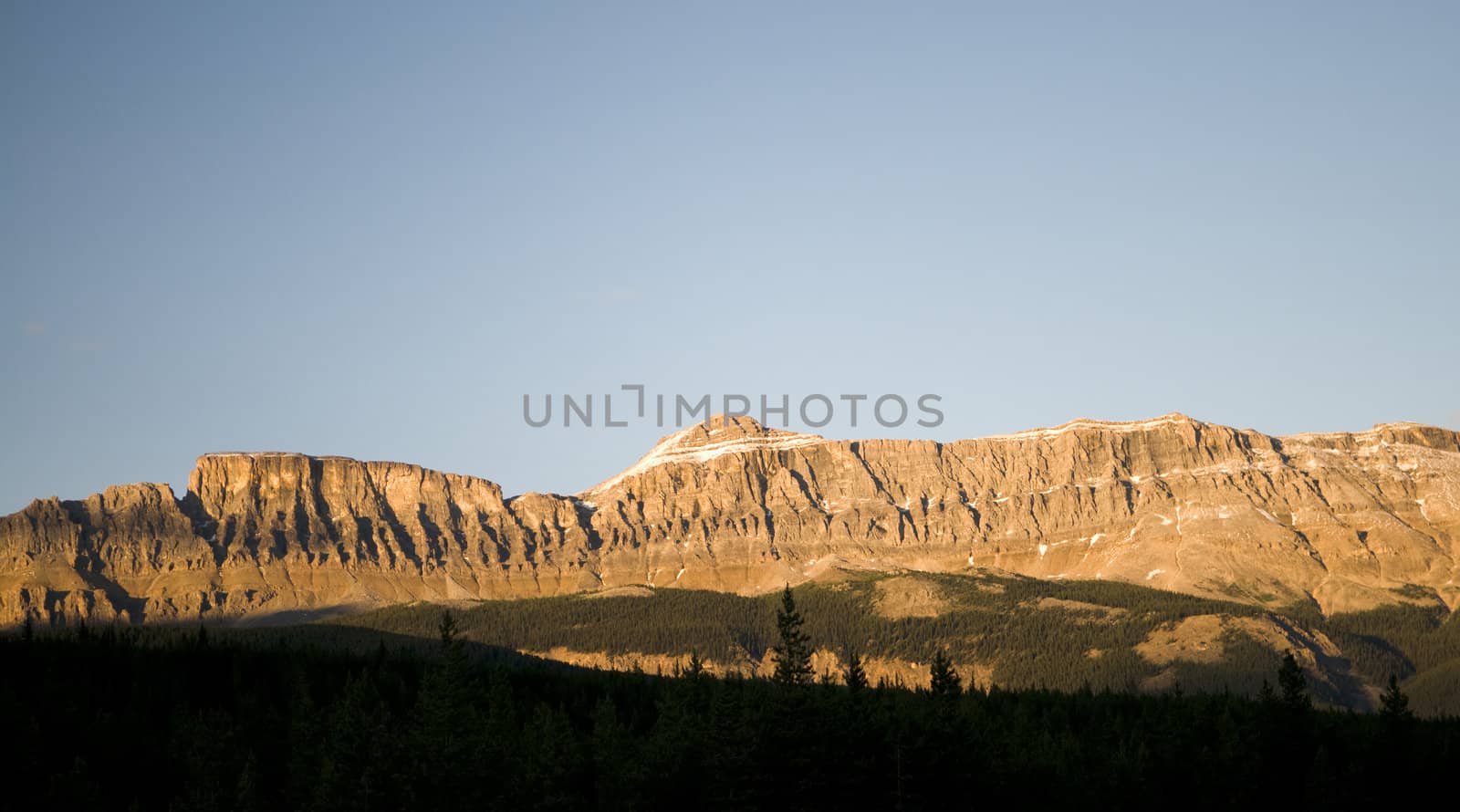 Golden Light On Mountains in Banff National Park