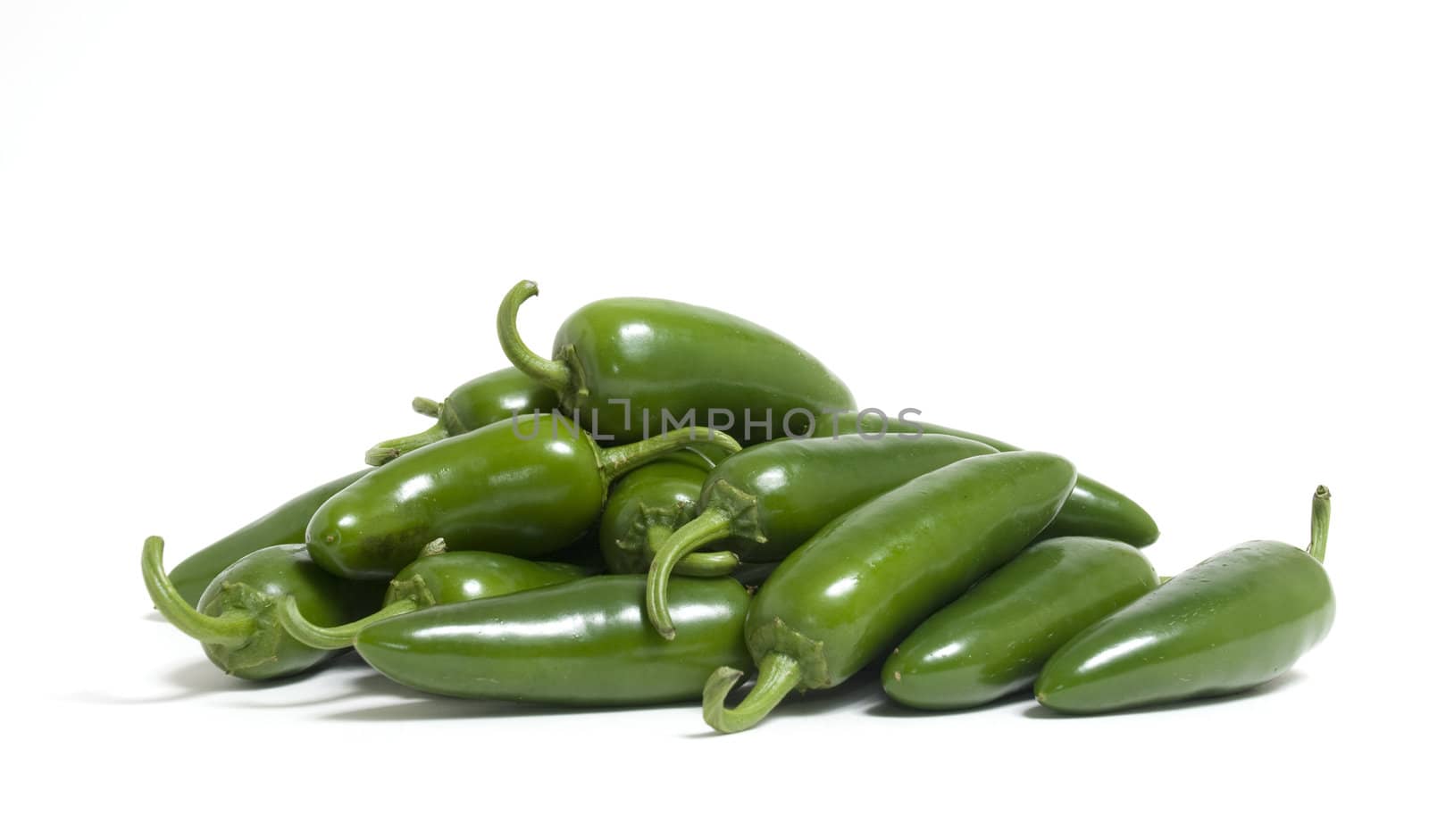 A bunch of hot jalapeno peppers on white background