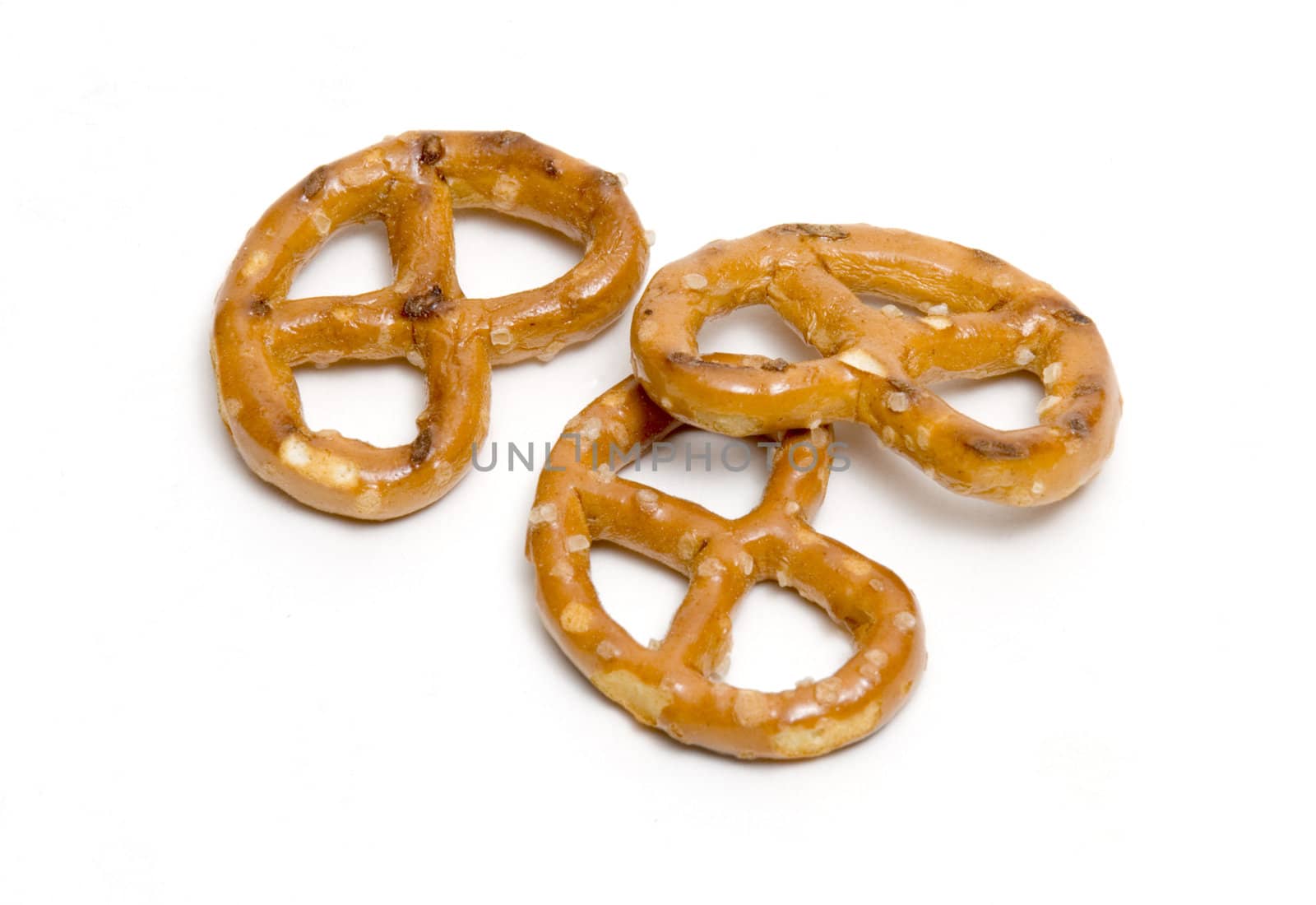 Three pretzels on white background