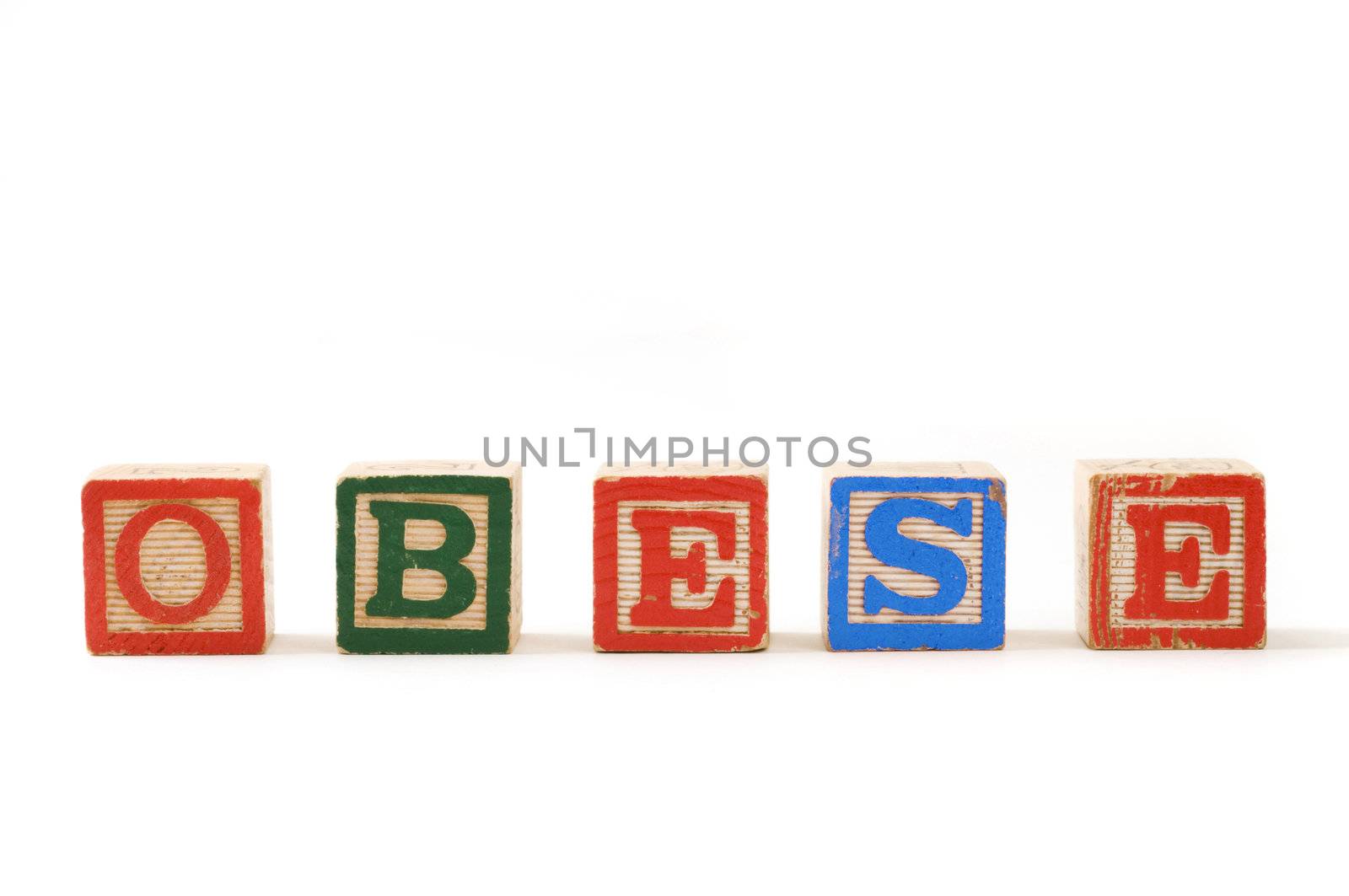 Children's wooden blocks spelling the word "Obese" on white background
