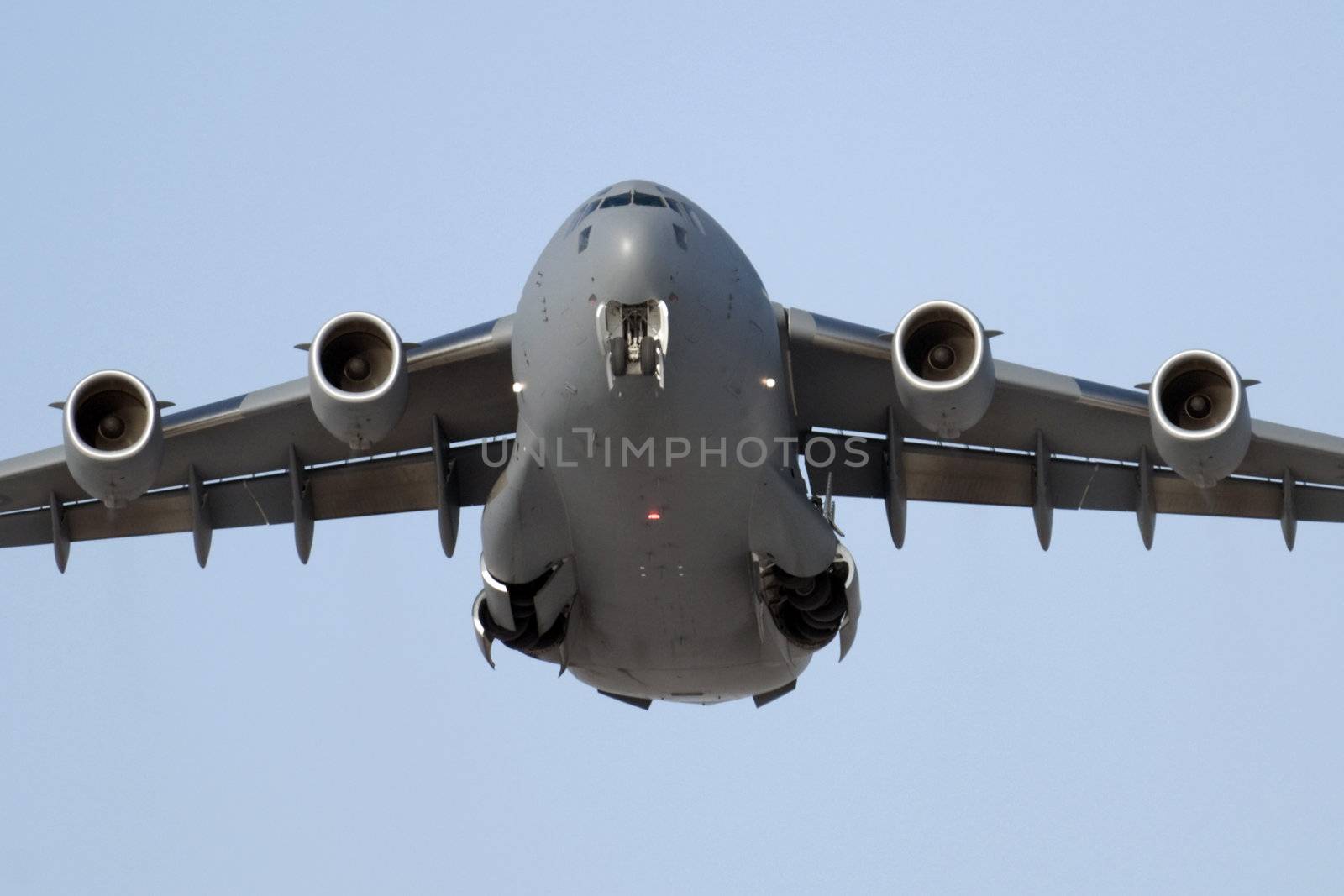 Transport plane coming in for a landing with the gear down
