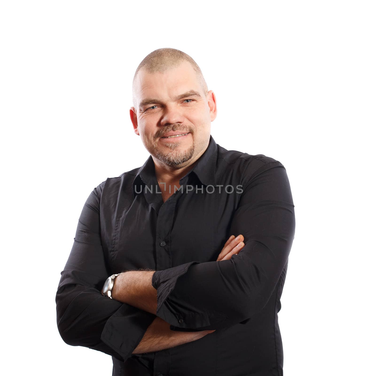 smiling, middle years man in black shirt on a white background