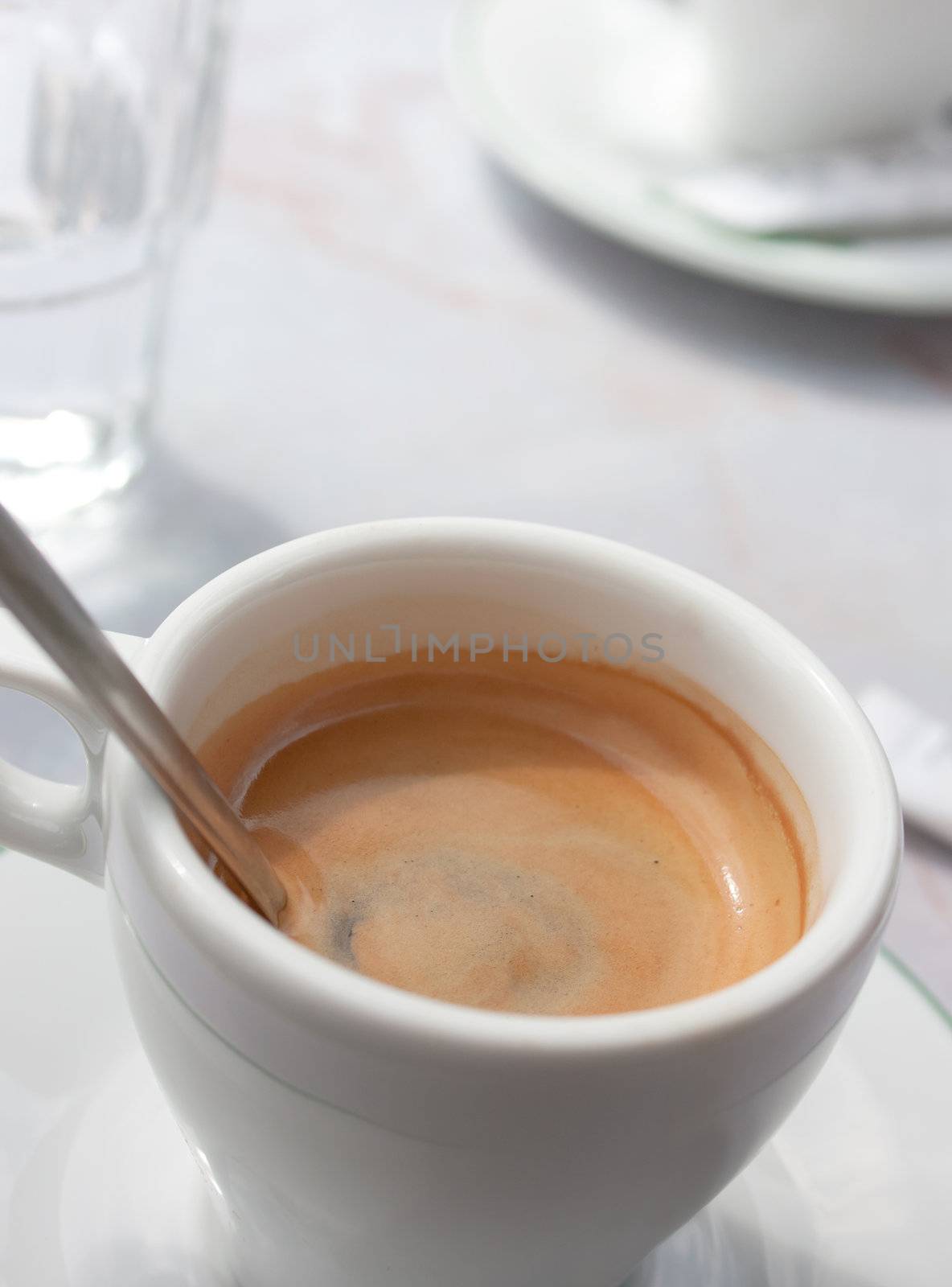 white cup of coffee, espresso and glass of water