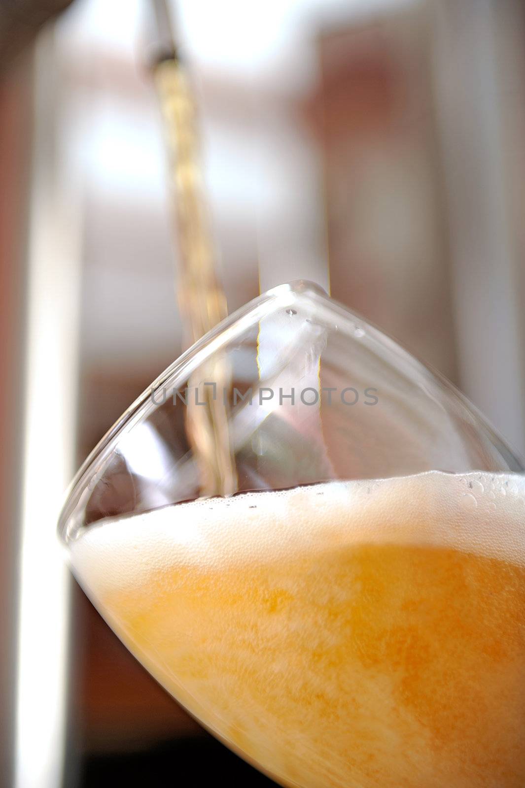 Beer into glass by Sevaljevic