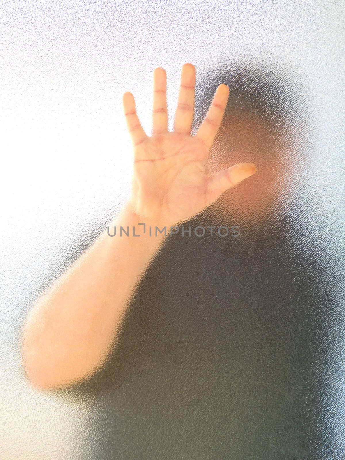 Silhouette of a man's body through frosted glass  by motorolka