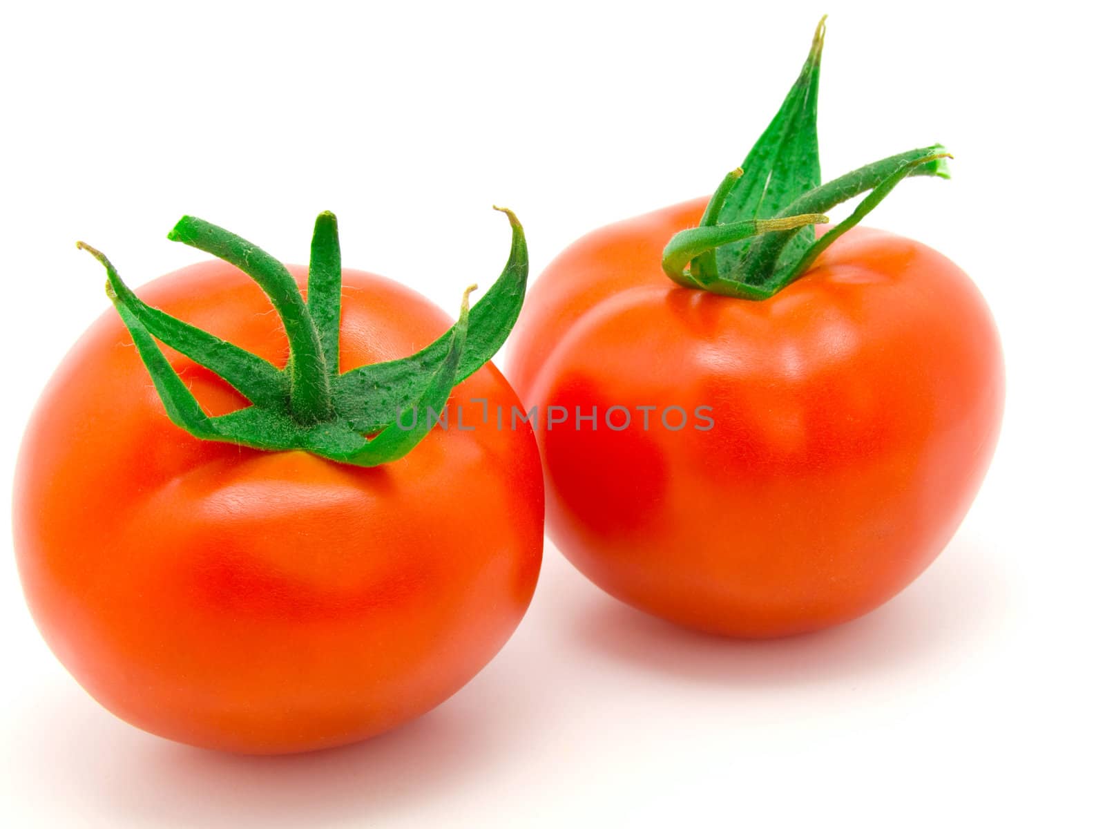 two red tomato isolated on white background. 